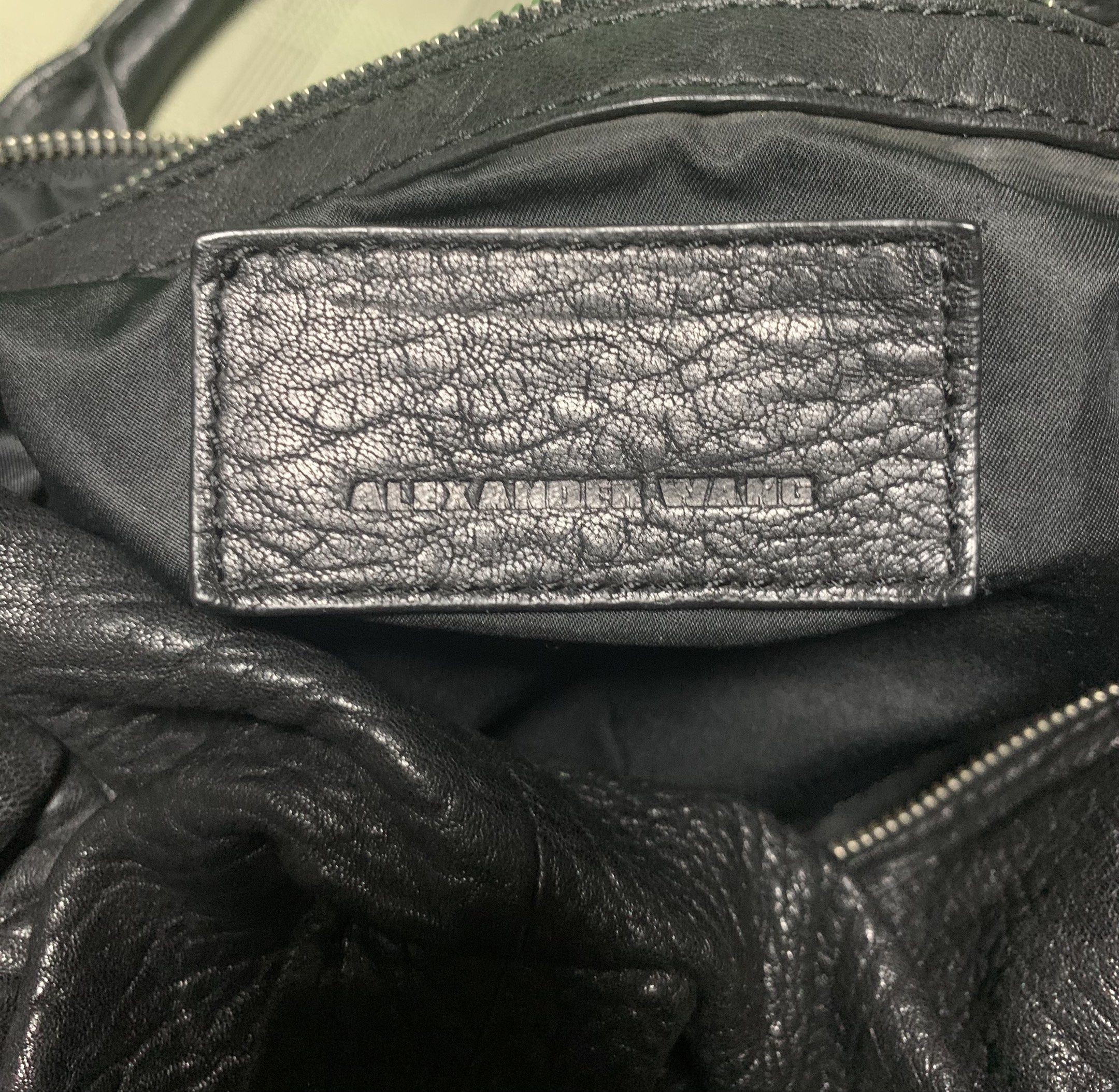 Alexander Wang Rocco Bag - Medium/Large (Category: Luxury Bags & Wallets) located in Quezon City. Submitted by carmeladelacruz82 (Listing ID 1417563059, Image 3). Description: - AUTHENTIC Alexander Wang Rocco Bag - Color: Black - Material: Leather - Condition: no major flaws; walang punit sa leather - Issue: small rip in the lining sa loob ng bag but barely noticeable.
