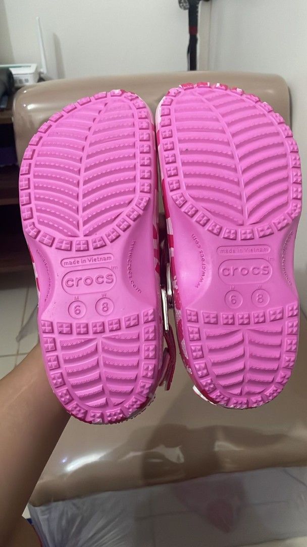 BAPE x Crocs Classic Clog Pink Camo (Category: Slippers & Slides) located in Valenzuela. Submitted by jannah528 (Listing ID 1417561058, Image 2). Description: - Authentic BAPE x Crocs Classic Clog - Pink camouflage design - Features BAPE branding and Jibbitz charms - Size: 6/8 - Made in Vietnam - Includes original tags.