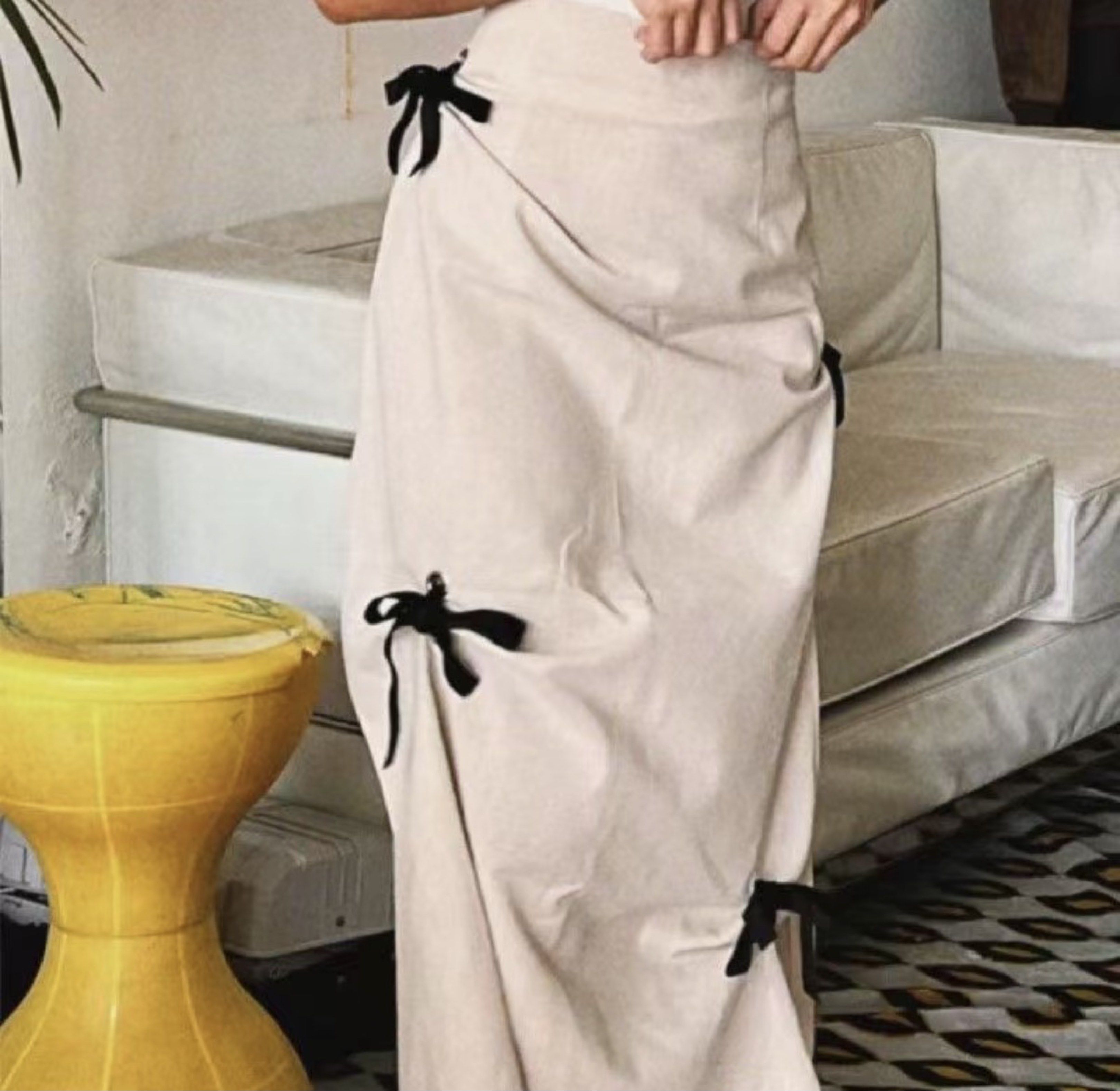 Beige Midi Skirt with Bows (Category: Skirts) located in Tanauan. Submitted by kdcstro (Listing ID 1417454866, Image 3). Description: Worn once during HK trip Fits size 26-27.