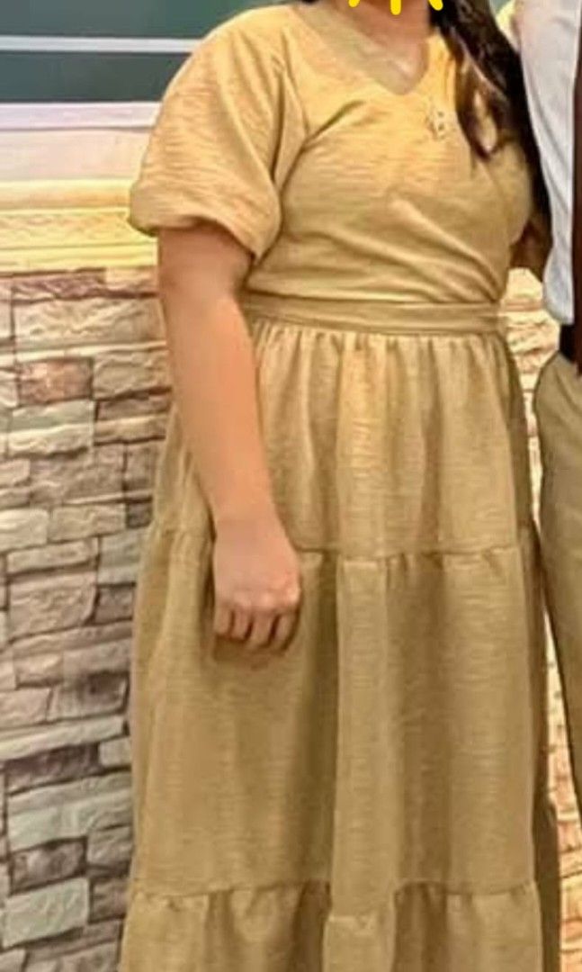 Brown Wrap Dress with Belt (Category: Dresses) located in Rizal. Submitted by zhellieme (Listing ID 1417440149, Image 3). Description: -Used only once - Brown wrap dress - V-neck design - Short sleeves with ruffled cuffs - Tiered skirt - Matching belt included - Textured fabric - Flowing silhouette - Suitable for various occasions.