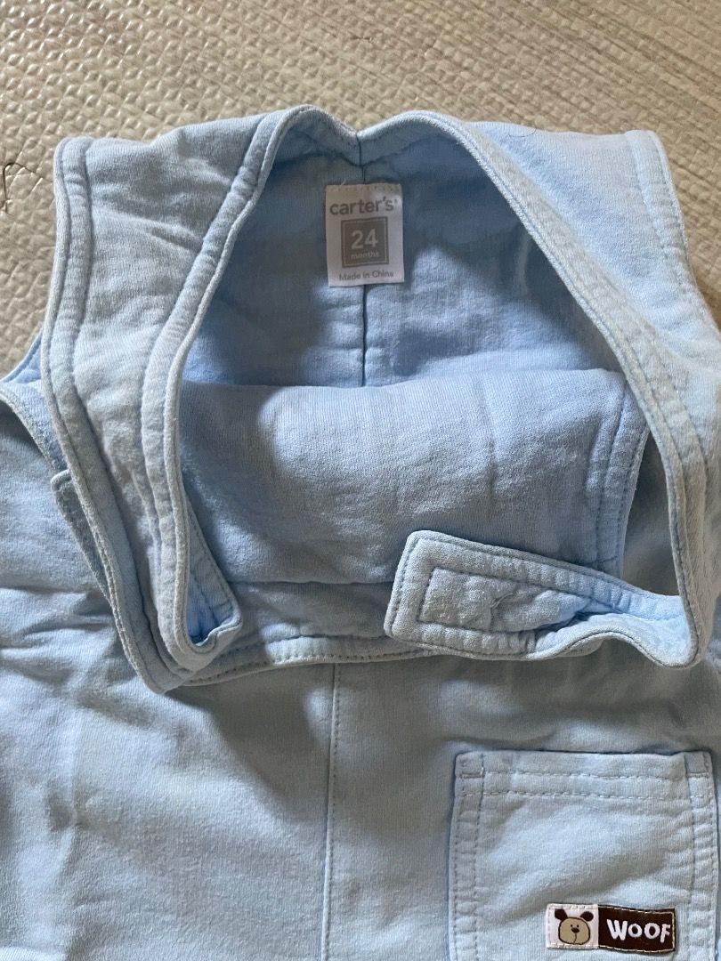Carter's Baby Sleeper 24 Months (Category: Cots & Cribs) located in Casiguran. Submitted by roseromano (Listing ID 1417446759, Image 2). Description: - Carter's baby sleeper for 24-month-olds. - Color: Light blue. - Design: 'Woof' patch on the pocket. - Made in China. - Features a collar. - Closure: Button closure. - Material: Soft and comfortable..