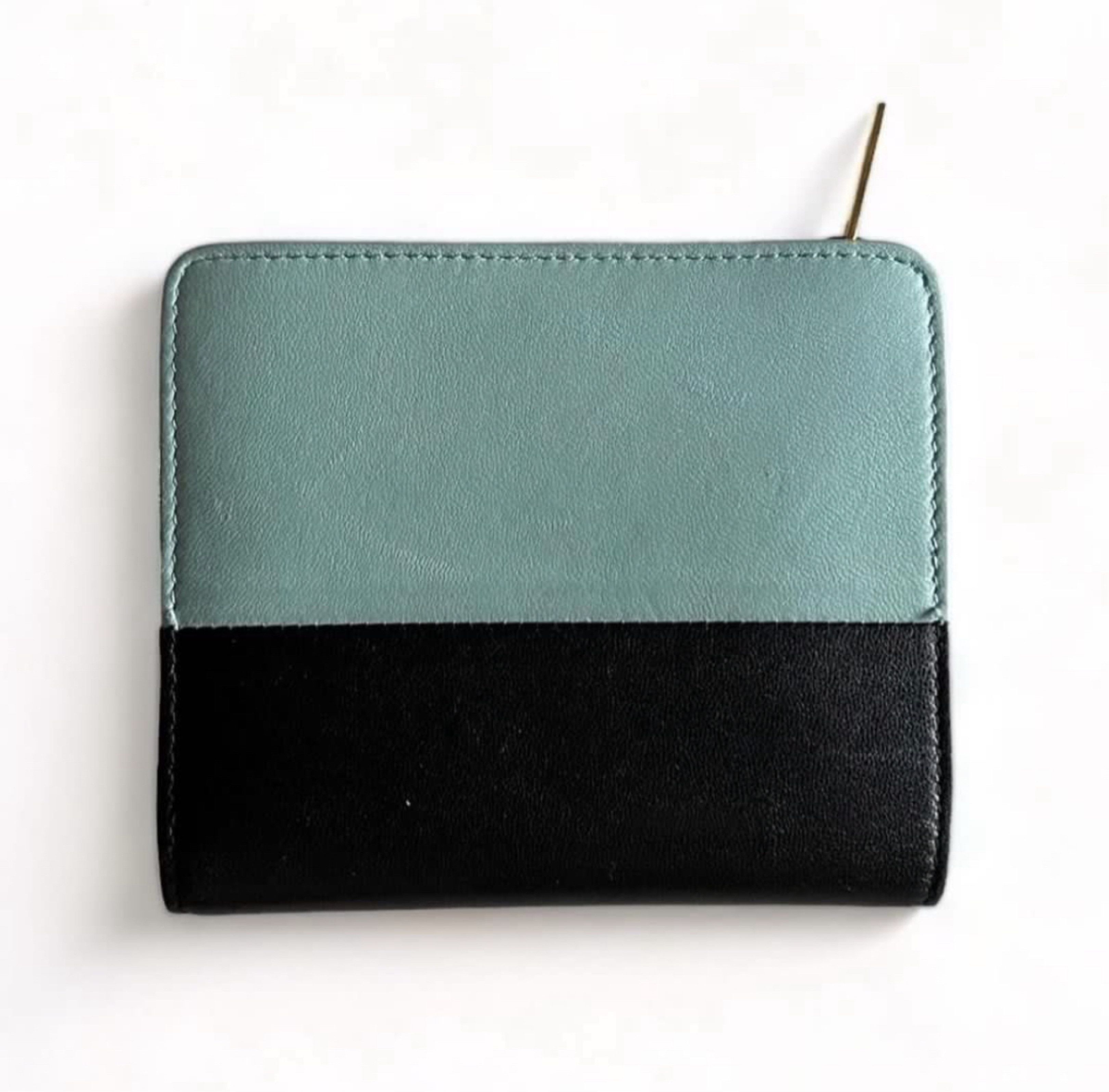 CELINE Bi-Color Leather Wallet (Category: Luxury Bags & Wallets) located in Davao. Submitted by allthisandmore (Listing ID 1417417225, Image 2). Description: Details: Bi-color black design | Smooth leather interior | matte finish with a fine grain | zip-around closure with slim leather zipper pull | compact square | central compartment for bills (folded) | card slots along the sides | zip compartment for coins Inclusion: Dust Bag Well Used (Light