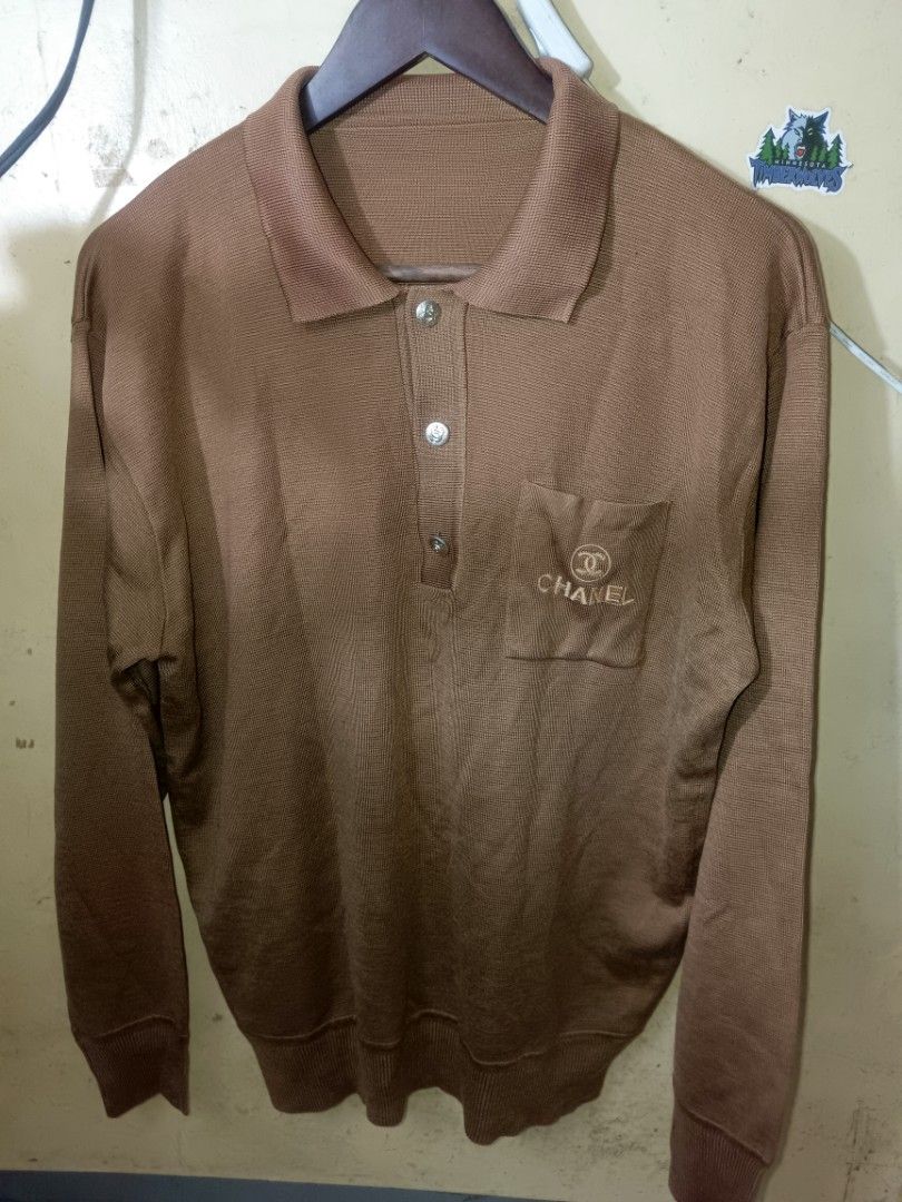 Chanel Long Sleeve Polo Shirt (Category: Luxury Apparel) located in Makati City. Submitted by bawalburaot (Listing ID 1417526172, Image 1). Description: - Chanel brown long sleeve polo shirt - Features a chest pocket with embroidered Chanel logo - Collared neckline - Button closure - Made of knit material.