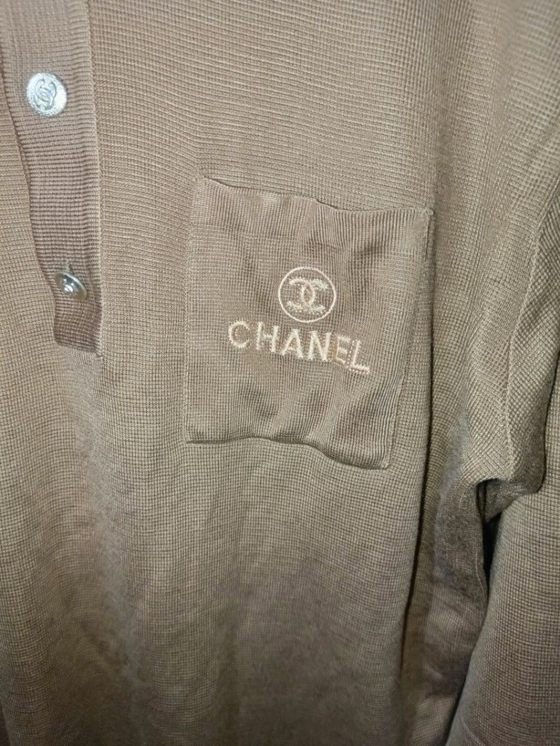 Chanel Long Sleeve Polo Shirt (Category: Luxury Apparel) located in Makati City. Submitted by bawalburaot (Listing ID 1417526172, Image 2). Description: - Chanel brown long sleeve polo shirt - Features a chest pocket with embroidered Chanel logo - Collared neckline - Button closure - Made of knit material.