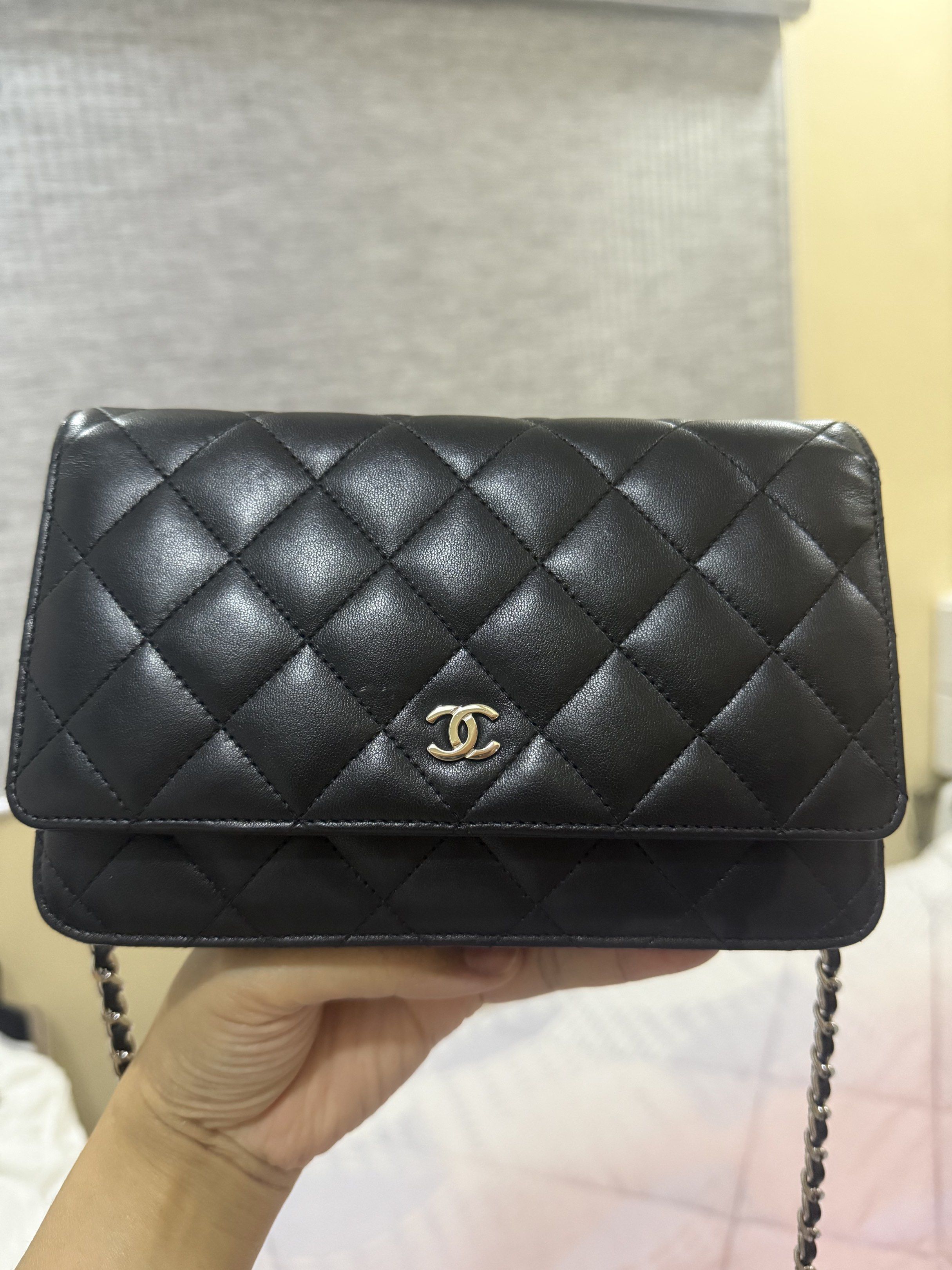 Chanel Wallet on Chain Black (Category: Luxury Bags & Wallets) located in Taguig. Submitted by bianca625 (Listing ID 1417570280, Image 1). Description: - Authentic Chanel Wallet on Chain - Black quilted lambskin leather - Chain strap - Iconic CC logo - Flap closure - Multiple interior compartments - Includes zippered pocket and card slots - Made in France Silver hardware -series 18 with holo intact With dustbag and card.