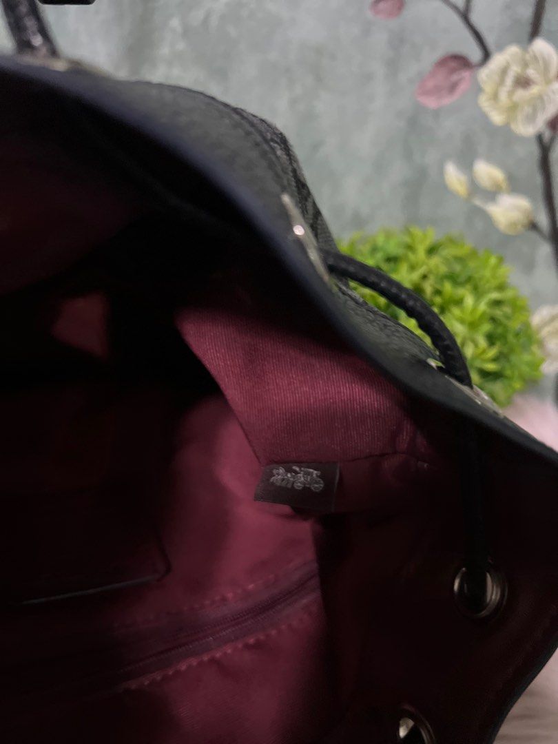 Coach Signature Bucket Bag (Category: Cross-body Bags) located in Quezon City. Submitted by sherashley (Listing ID 1417514081, Image 3). Description: Pre-loved Coach bucket bag with guitar strap .