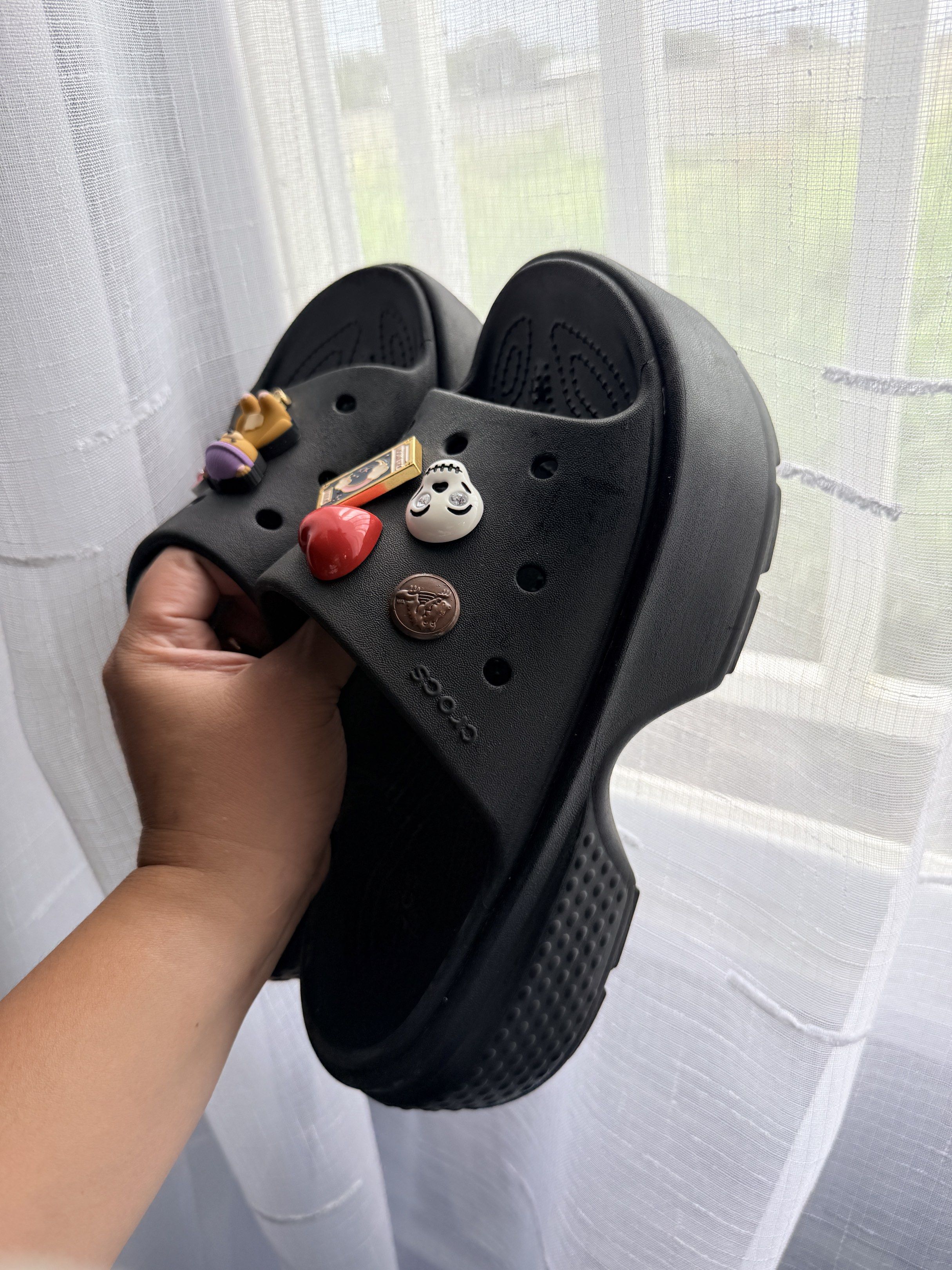 Crocs Classic Platform Slide Black (Category: Slippers and slides) located in Himamaylan. Submitted by EsClosetCleanUp (Listing ID 1417479230, Image 3). Description: - Black Crocs Classic Platform Slide sandals - Includes several Jibbitz charms - Features a platform sole - Crocs logo visible.