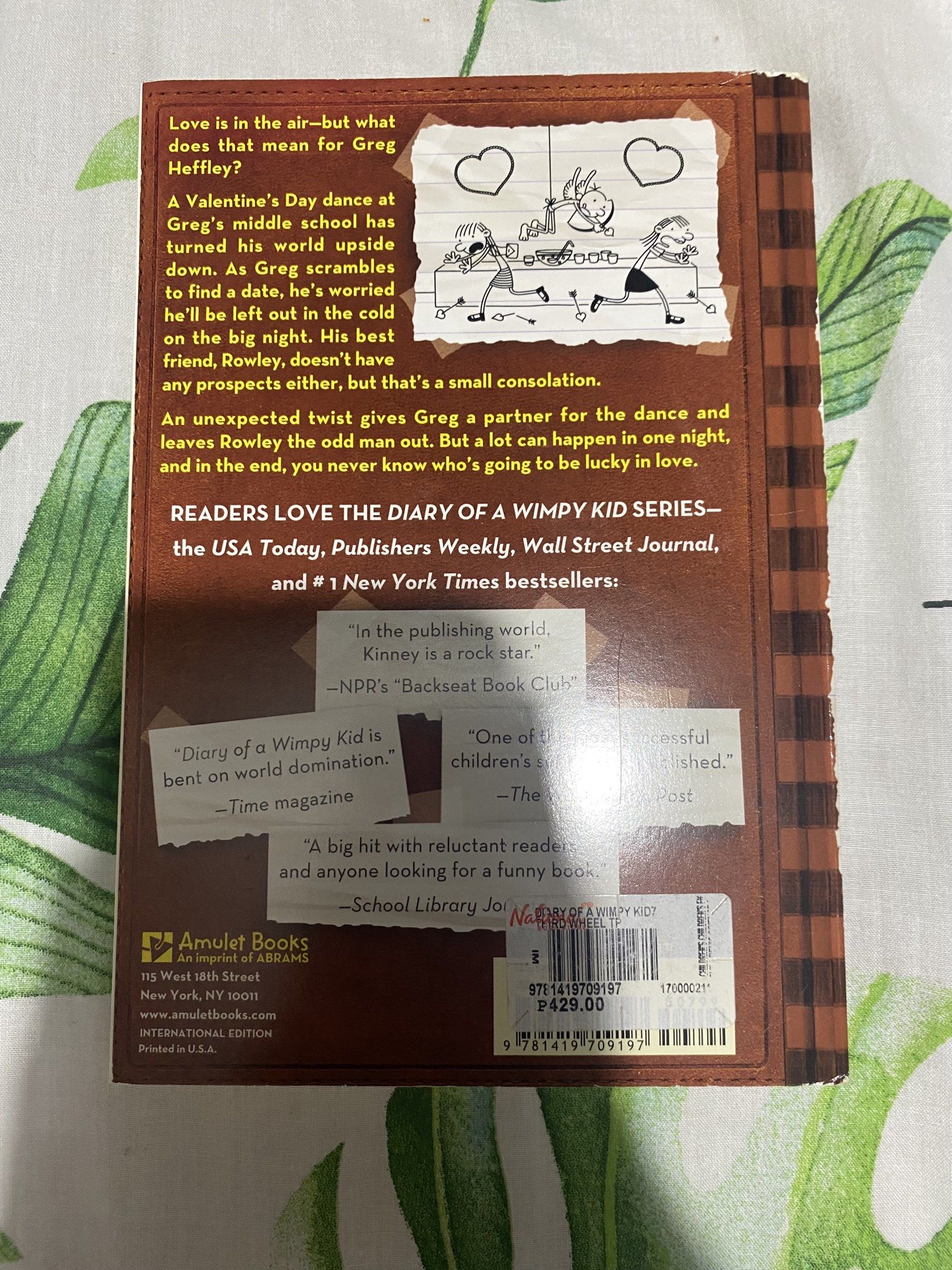 Diary of a Wimpy Kid Book 7 (Category: Storybooks) located in Manila. Submitted by stephora.pixel (Listing ID 1417546317, Image 2). Description: - Diary of a Wimpy Kid: The Third Wheel - Part of the international best-selling series - Features Greg Heffley's Valentine's Day dance - Published by Amulet Books - Price: ₱429.00.