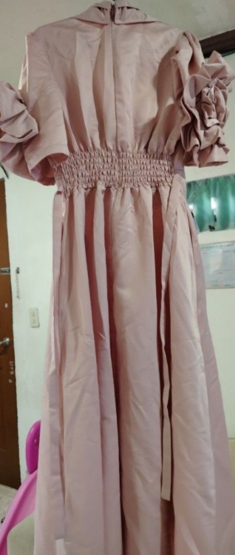 Dusty Rose Formal Dress (Category: Dresses) located in Rizal. Submitted by zhellieme (Listing ID 1417469170, Image 2). Description: -Used only once - Elegant dusty rose formal dress - Features a flattering V-neckline - Unique ruffled sleeves - Fitted bodice - Flowing skirt - Shirred waist with tie detail at the back - Perfect for special occasions.