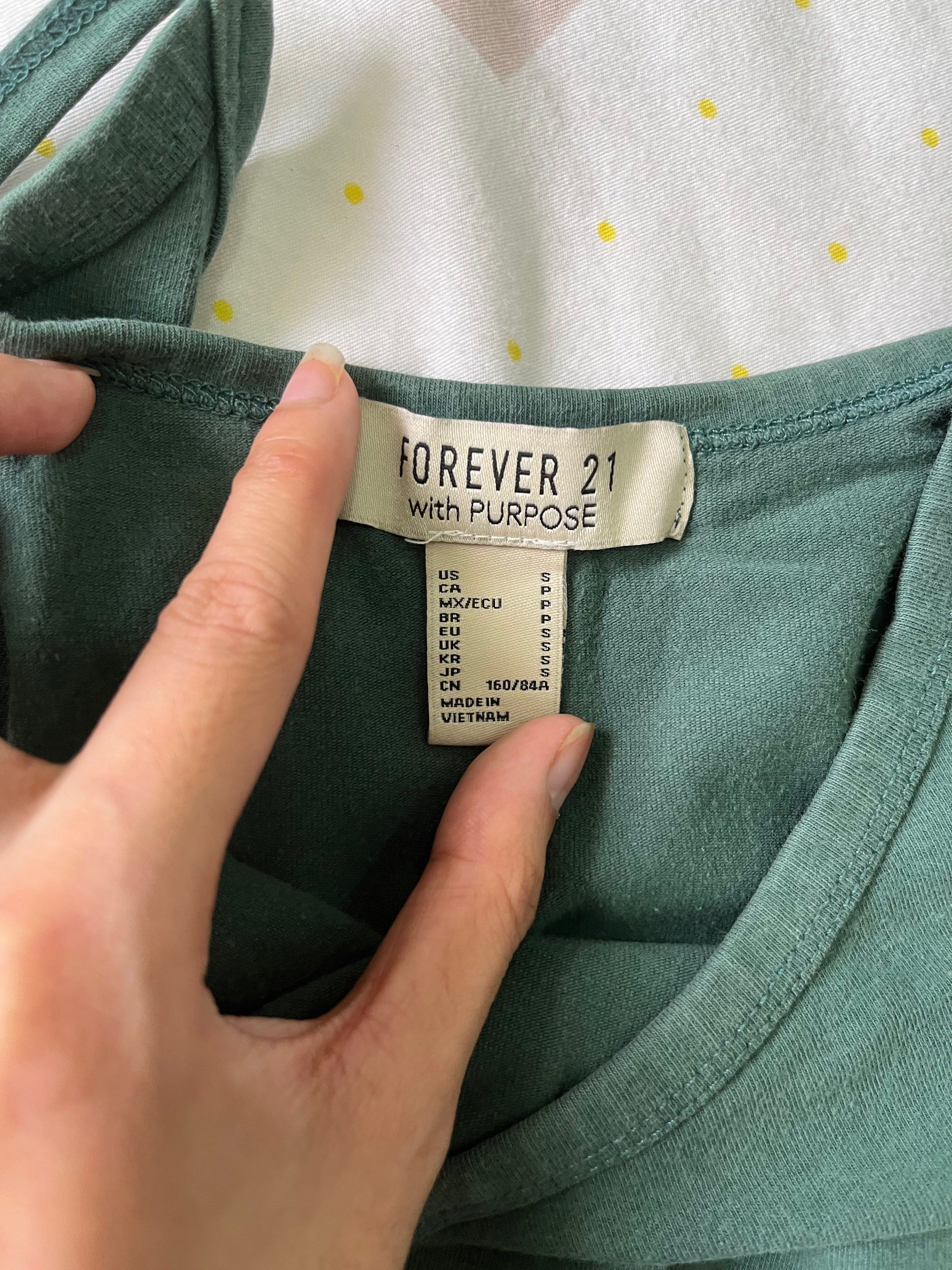 Forever 21 Green Tank Top - Size S (Category: Sleeveless) located in Quezon City. Submitted by goatedls (Listing ID 1417431190, Image 2). Description: - Forever 21 tank top - Size: Small - Color: Green - Style: Spaghetti strap - Material: Soft and comfortable.