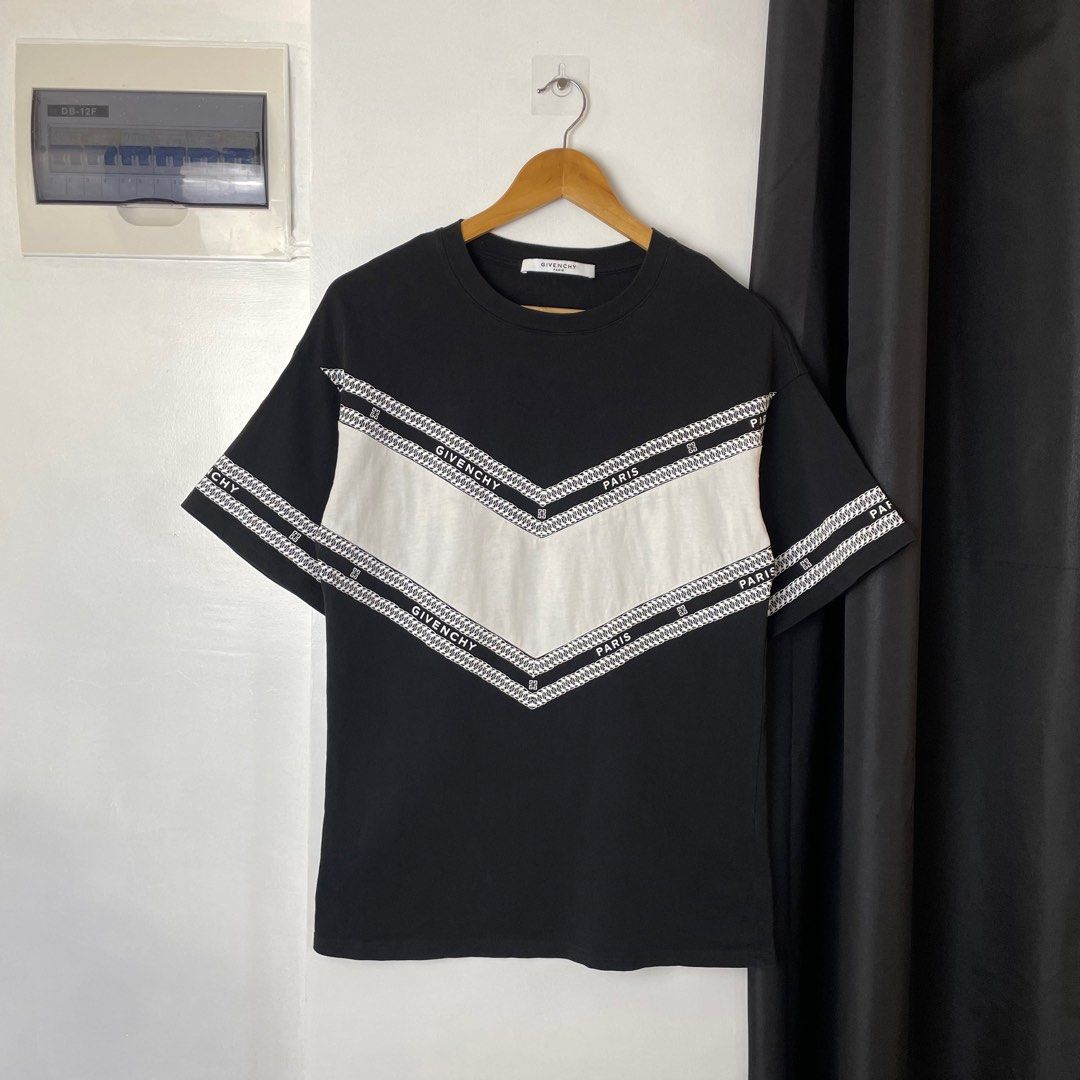 Givenchy Paris Black and White T-shirt (Category: Tshirts & Polo Shirts ) located in Paranaque City. Submitted by hidden_v2 (Listing ID 1417477243, Image 1). Description: Givenchy T Shirt Very Good Condition Size Small on tag White V-shaped logo chain print across the chest and sleeves, has dirt on the V-Shape. Width: 18.5 Length: 27.5 .