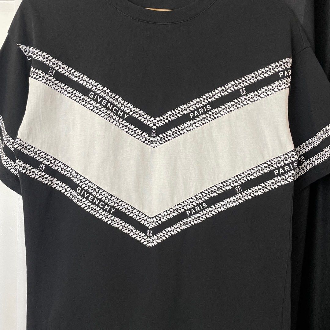 Givenchy Paris Black and White T-shirt (Category: Tshirts & Polo Shirts ) located in Paranaque City. Submitted by hidden_v2 (Listing ID 1417477243, Image 3). Description: Givenchy T Shirt Very Good Condition Size Small on tag White V-shaped logo chain print across the chest and sleeves, has dirt on the V-Shape. Width: 18.5 Length: 27.5 .