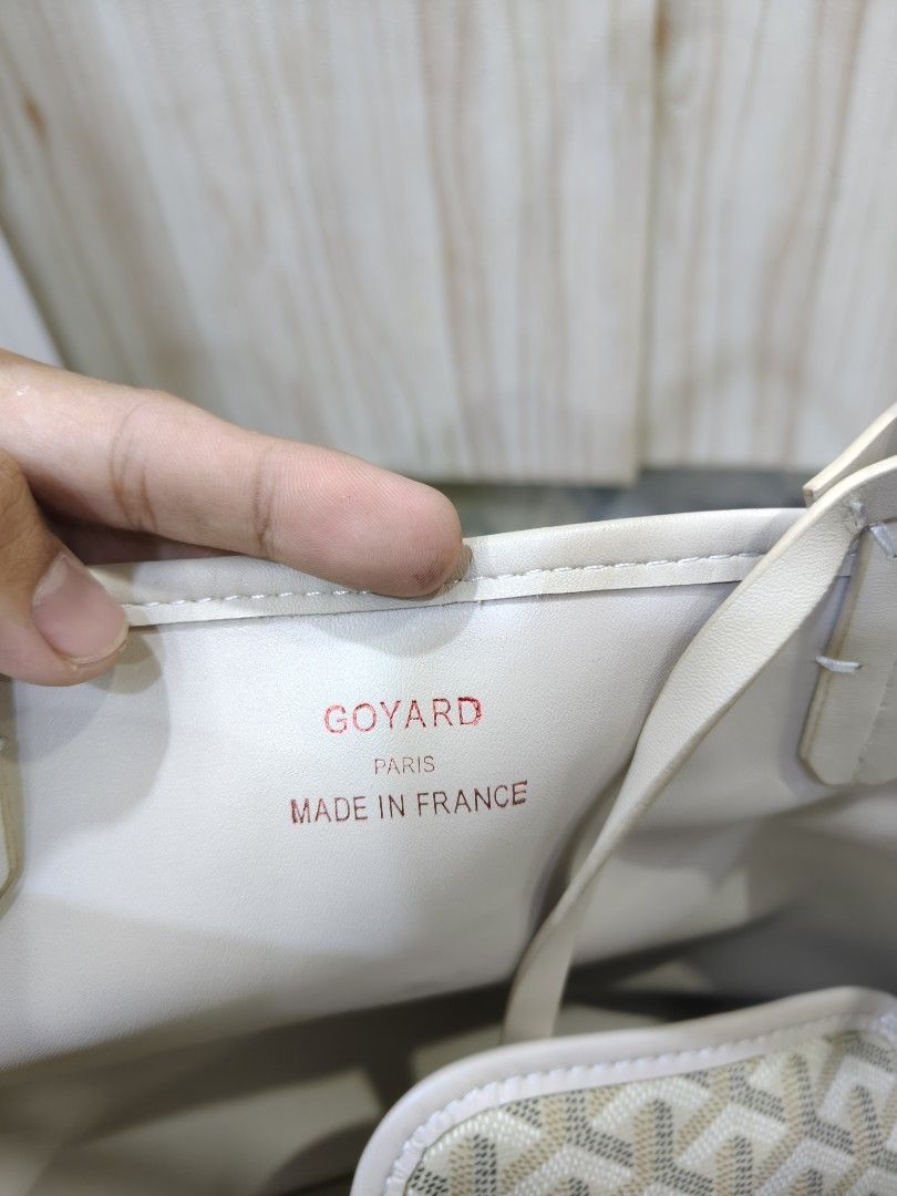 Goyard Tote Bag (Category: Luxury Bags & Wallets) located in Davao. Submitted by navil01 (Listing ID 1417536152, Image 3). Description: - Goyard tote bag - Features the iconic Goyardine pattern - Includes a matching pouch - Interior color: Light beige - Handle color: Light beige - Made in France - Serial number present - Rectangular base.