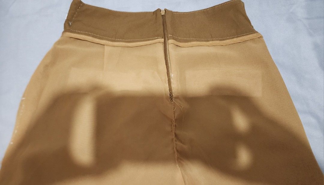 High-Waisted Shorts with Button Detail (Category: Shorts) located in Imus. Submitted by sashafame (Listing ID 1417548886, Image 2). Description: - High-waisted design - Button details - Back zipper closure - Solid brown color - Lightweight fabric - Wide leg opening - Ideal for warm weather - with flaws on inside.