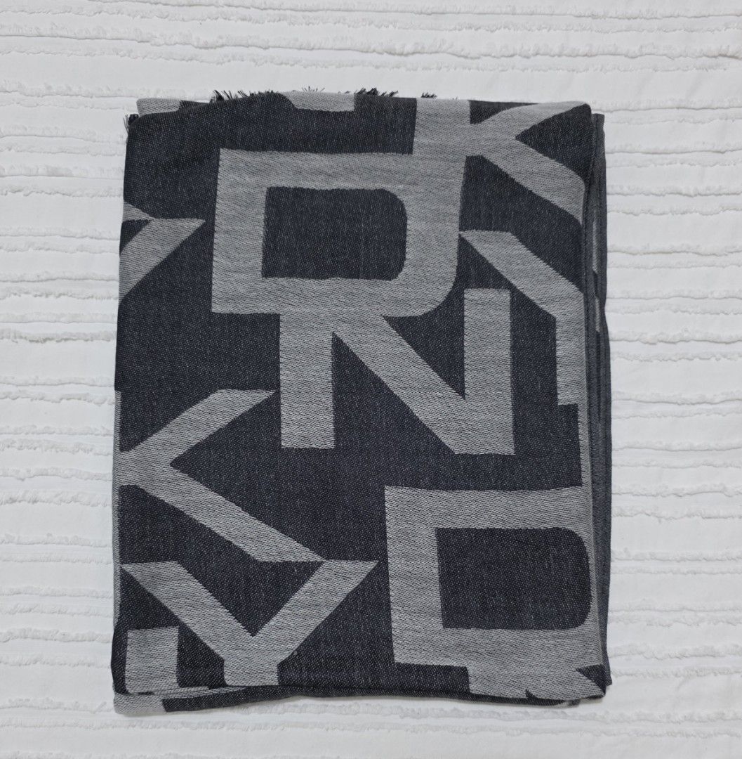 DKNY Jacquard Logo Woven Scarf (Category: Scarves) located in Taguig. Submitted by iamloulouvi (Listing ID 1417597047, Image 2). Description: - Price is firm - This is a thin scarf made of 55% viscose (premium material) and 45% polyester, suitable for spring/fall. Also good for Ph weather during the cooler months. Not suitable for winter in temperare climates (those scarves are typically made of acrylic, wool, cashmere, mohair mixed with polyeste