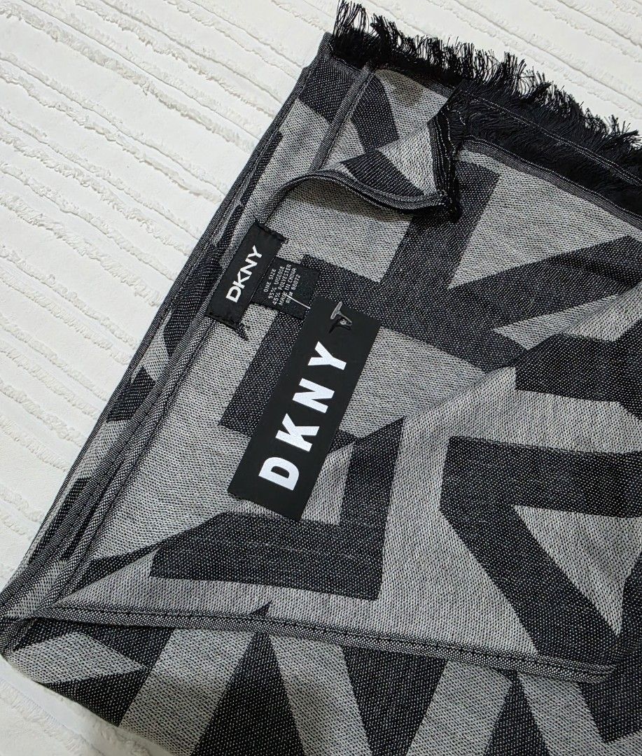 DKNY Jacquard Logo Woven Scarf (Category: Scarves) located in Taguig. Submitted by iamloulouvi (Listing ID 1417597047, Image 3). Description: - Price is firm - This is a thin scarf made of 55% viscose (premium material) and 45% polyester, suitable for spring/fall. Also good for Ph weather during the cooler months. Not suitable for winter in temperare climates (those scarves are typically made of acrylic, wool, cashmere, mohair mixed with polyeste