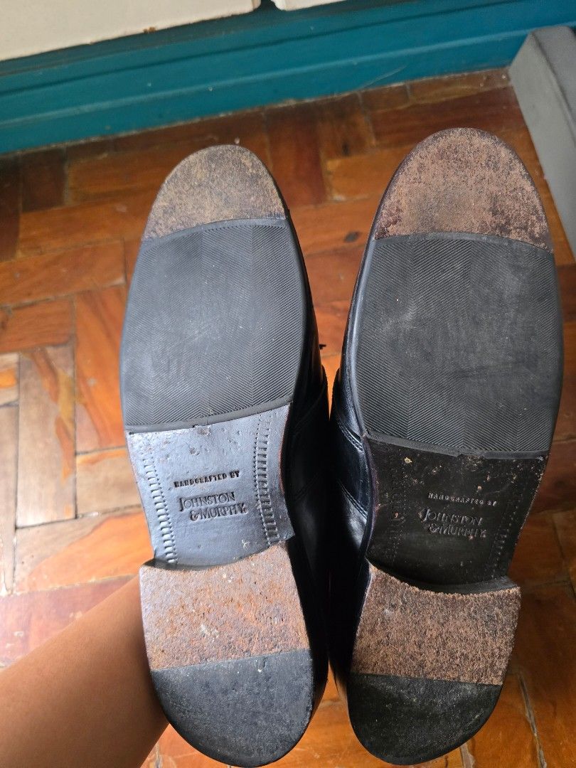 Johnston & Murphy Black Leather Tassel Loafers (Category: Dress Shoes) located in Quezon City. Submitted by quirkfox77 (Listing ID 1417582453, Image 3). Description: Classic black leather loafers from Johnston & Murphy. Features a tassel design and a slip-on style. The shoes have a leather sole and a cushioned insole. The size is 7.5 M. The shoes appear to be well-maintained and ready for wear. Perfect for both formal and casual occasions..