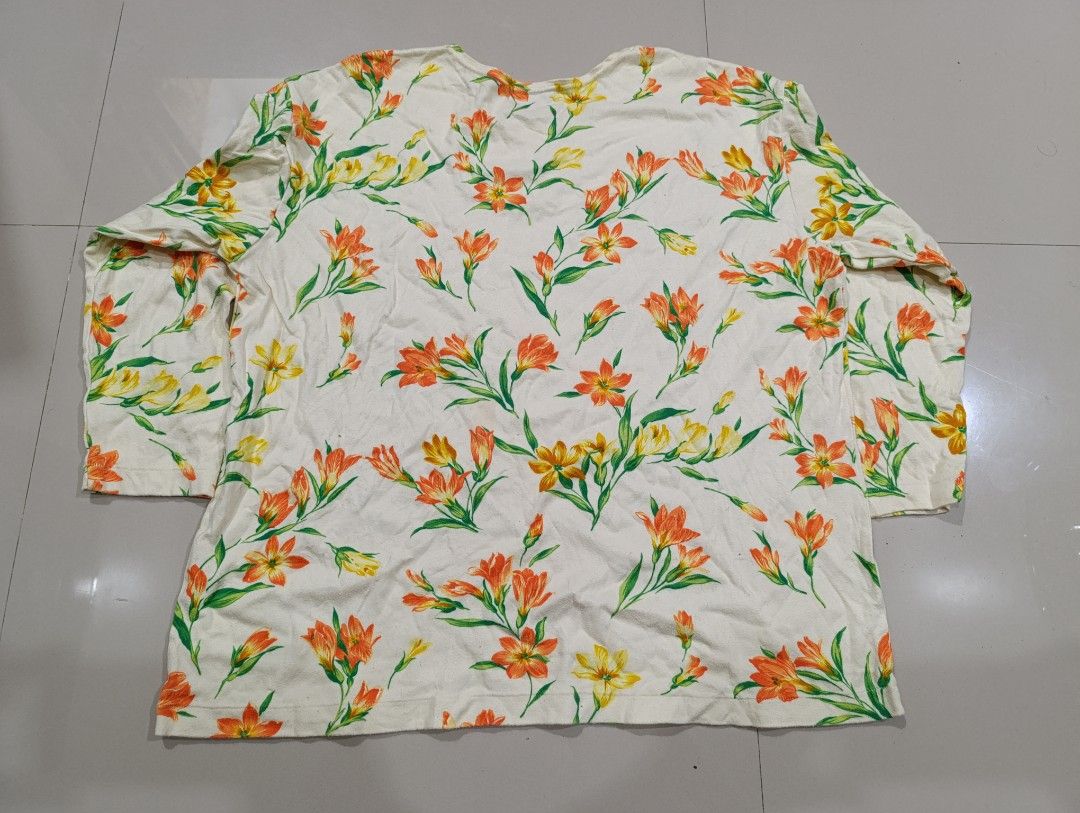 Kenzo Floral Long Sleeve Top - Medium (Category: Luxury Apparel) located in Davao. Submitted by idioticthrifter (Listing ID 1417556168, Image 3). Description: - Kenzo long sleeve top - Features a vibrant floral print - Round neckline - Size: Medium - Made in Japan - Lightweight fabric - Colors: Orange and yellow flowers on a cream background -issues: minimal lints and need wash - dimension: 22.5 x 25.