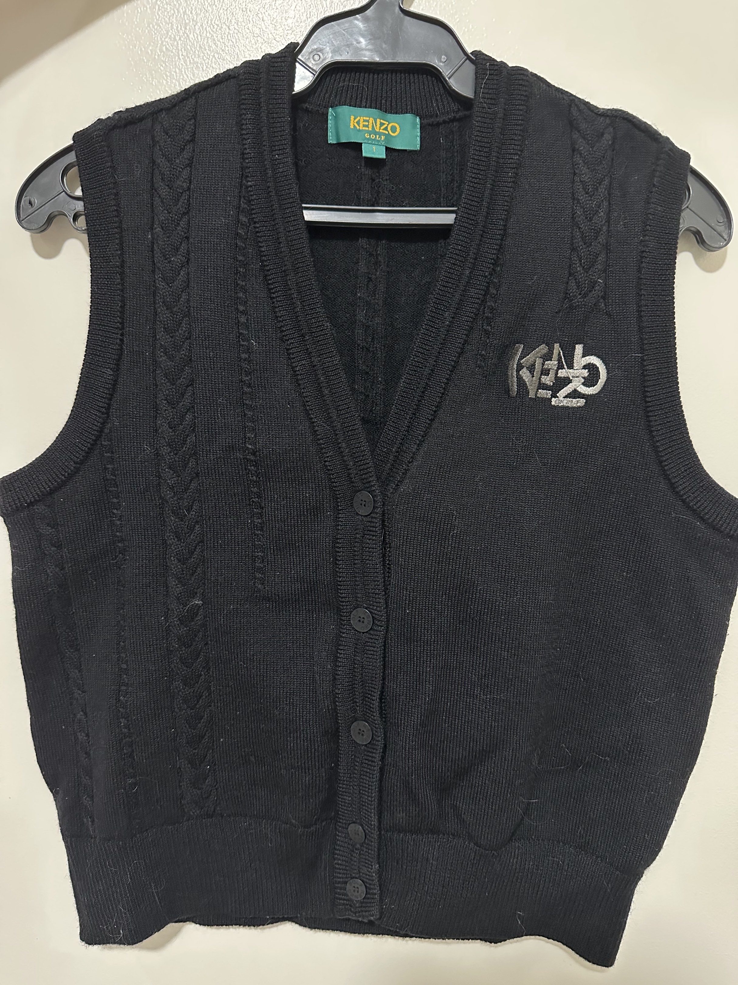 SUPERSALE!! Kenzo Golf Black Vest (Category: Vests) located in Tagaytay City. Submitted by rosiesfashionfinds (Listing ID 1417445166, Image 1). Description: - Black Kenzo Golf vest - V-neck and button closure - Kenzo Golf logo on chest - Size 1 - Made in Japan - Material: 100% wool - Care: Dry clean only.
