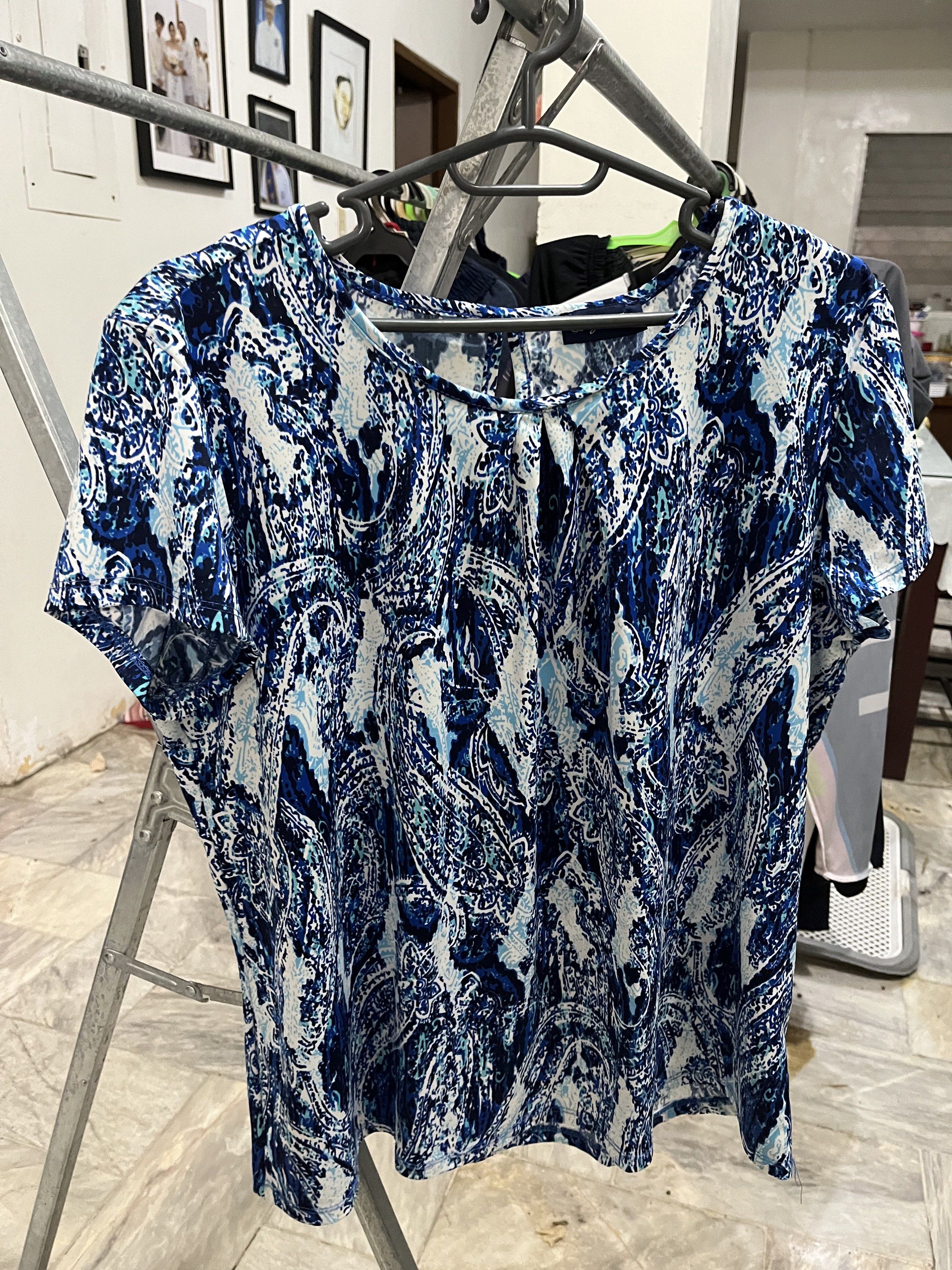 Lazer & Co Blue Paisley Blouse (Category: Sleeveless) located in Marikina City. Submitted by hello-yellow (Listing ID 1417483238, Image 1). Description: - Lazer & Co. brand - Paisley print in blue and white - Fit medium to XL. Loose fit. - Keyhole detail at the back - Comfortable for everyday wear.