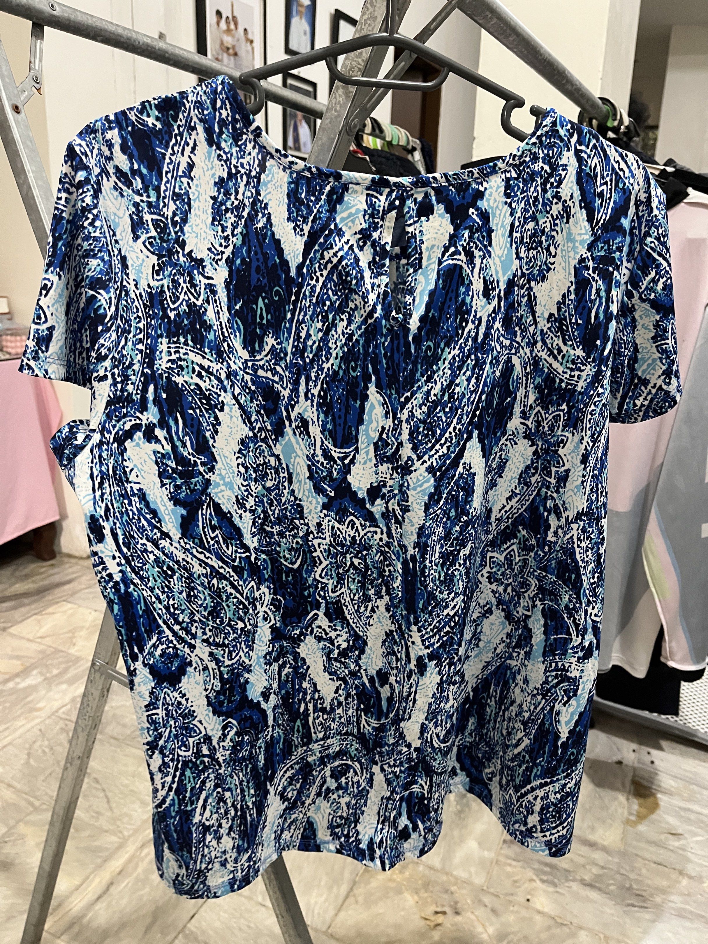 Lazer & Co Blue Paisley Blouse (Category: Sleeveless) located in Marikina City. Submitted by hello-yellow (Listing ID 1417483238, Image 2). Description: - Lazer & Co. brand - Paisley print in blue and white - Fit medium to XL. Loose fit. - Keyhole detail at the back - Comfortable for everyday wear.