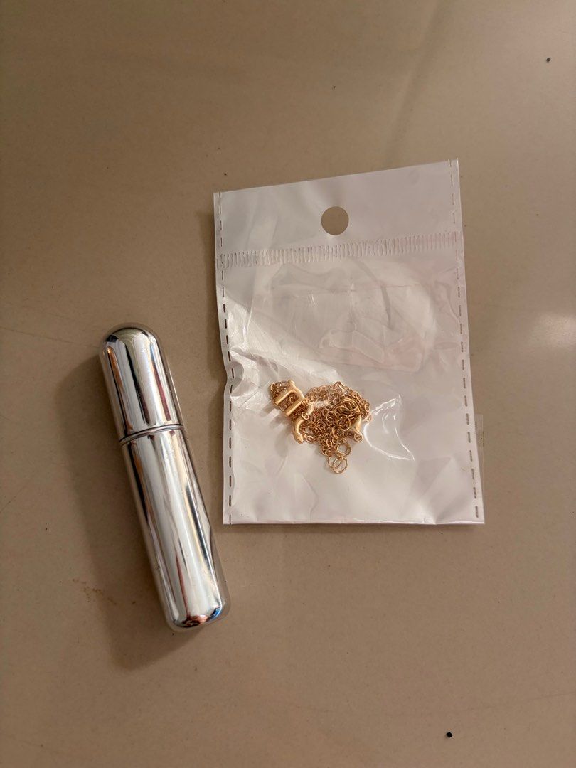 Letter M necklace and perfume spray (Category: Necklaces) located in Pasig City. Submitted by mxbutterfly (Listing ID 1417468299, Image 1). Description: From orange app.