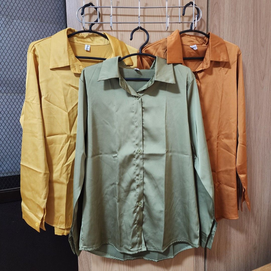 Long Sleeve Button Down Shirt (Category: Tshirts & Polo Shirts ) located in Cebu City. Submitted by deecanon (Listing ID 1417552544, Image 2). Description: - Long-sleeved button-down shirts - Available colors: green, orange, brown, blue, pink - Made of a smooth, possibly satin-like material - Features a collar and buttoned cuffs WASHED ONLY, BUT NEVER USED.