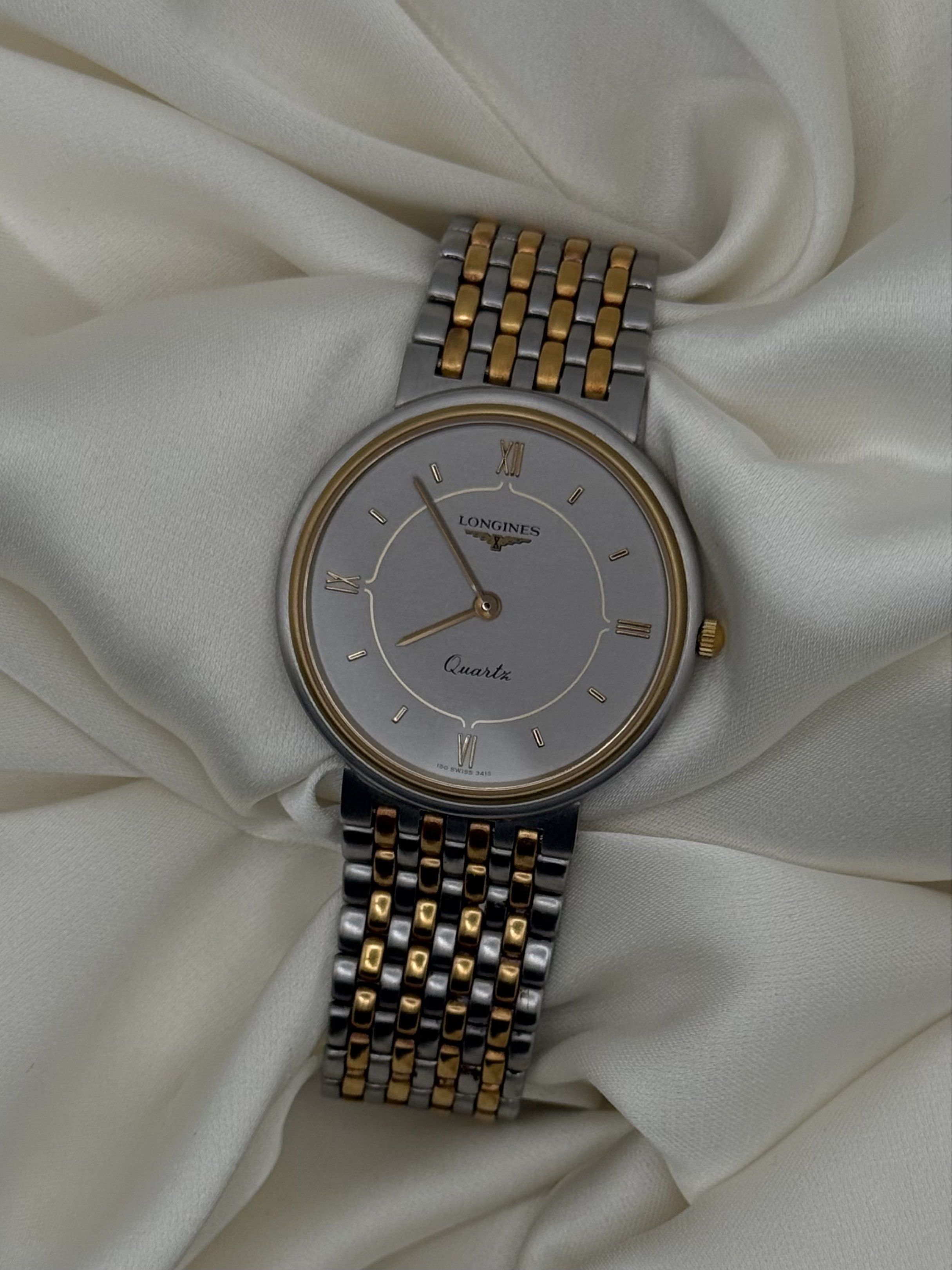 Longines Quartz Watch Two Toned (Category: Luxury Watches) located in Alitagtag. Submitted by watchoutph (Listing ID 1417596417, Image 1). Description: - Longines quartz watch - Silver dial with gold accents - Two-tone stainless steel and gold bracelet - Comes with original box - Classic design - Roman numeral hour markers.