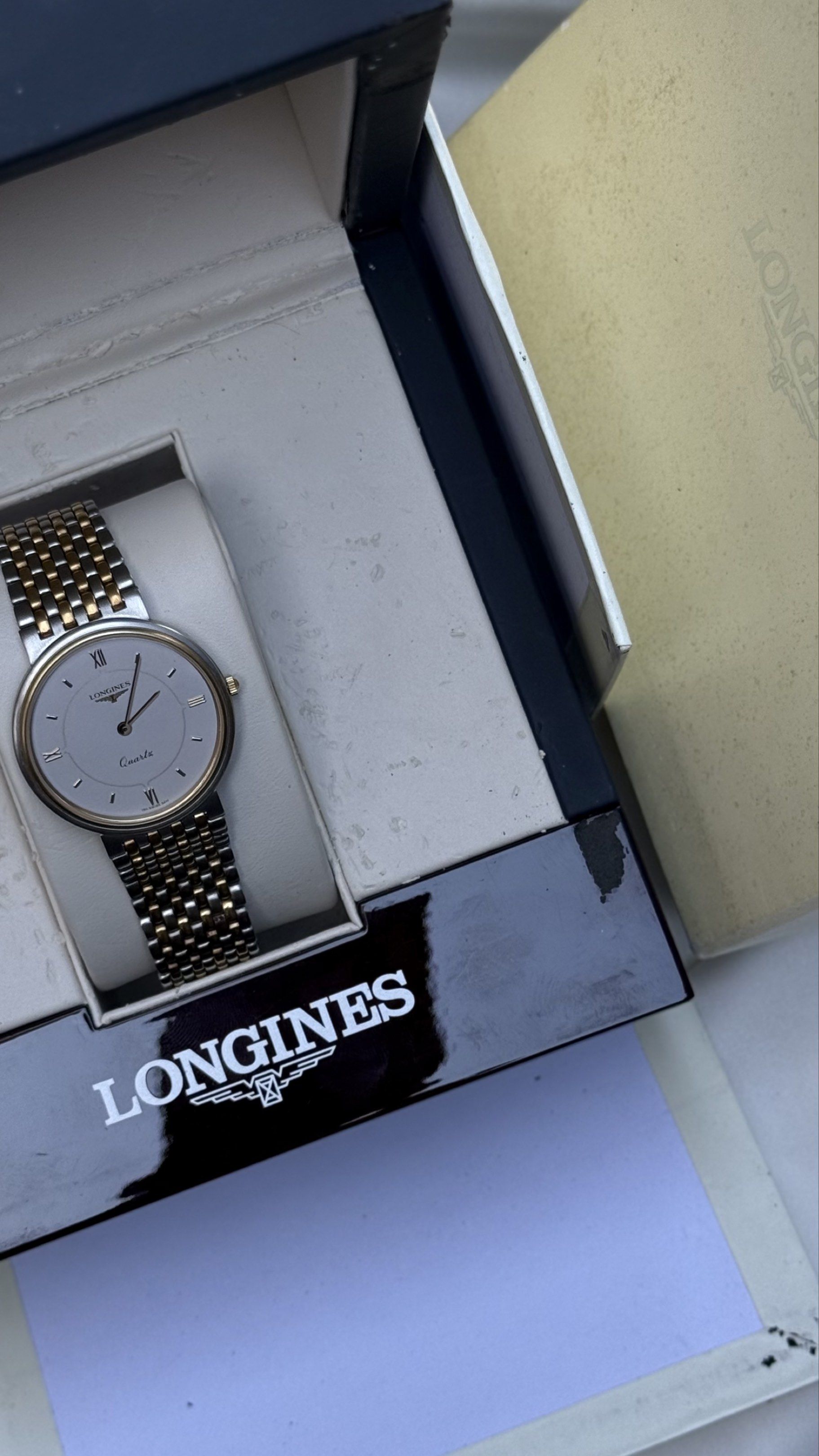 Longines Quartz Watch Two Toned (Category: Luxury Watches) located in Alitagtag. Submitted by watchoutph (Listing ID 1417596417, Image 2). Description: - Longines quartz watch - Silver dial with gold accents - Two-tone stainless steel and gold bracelet - Comes with original box - Classic design - Roman numeral hour markers.