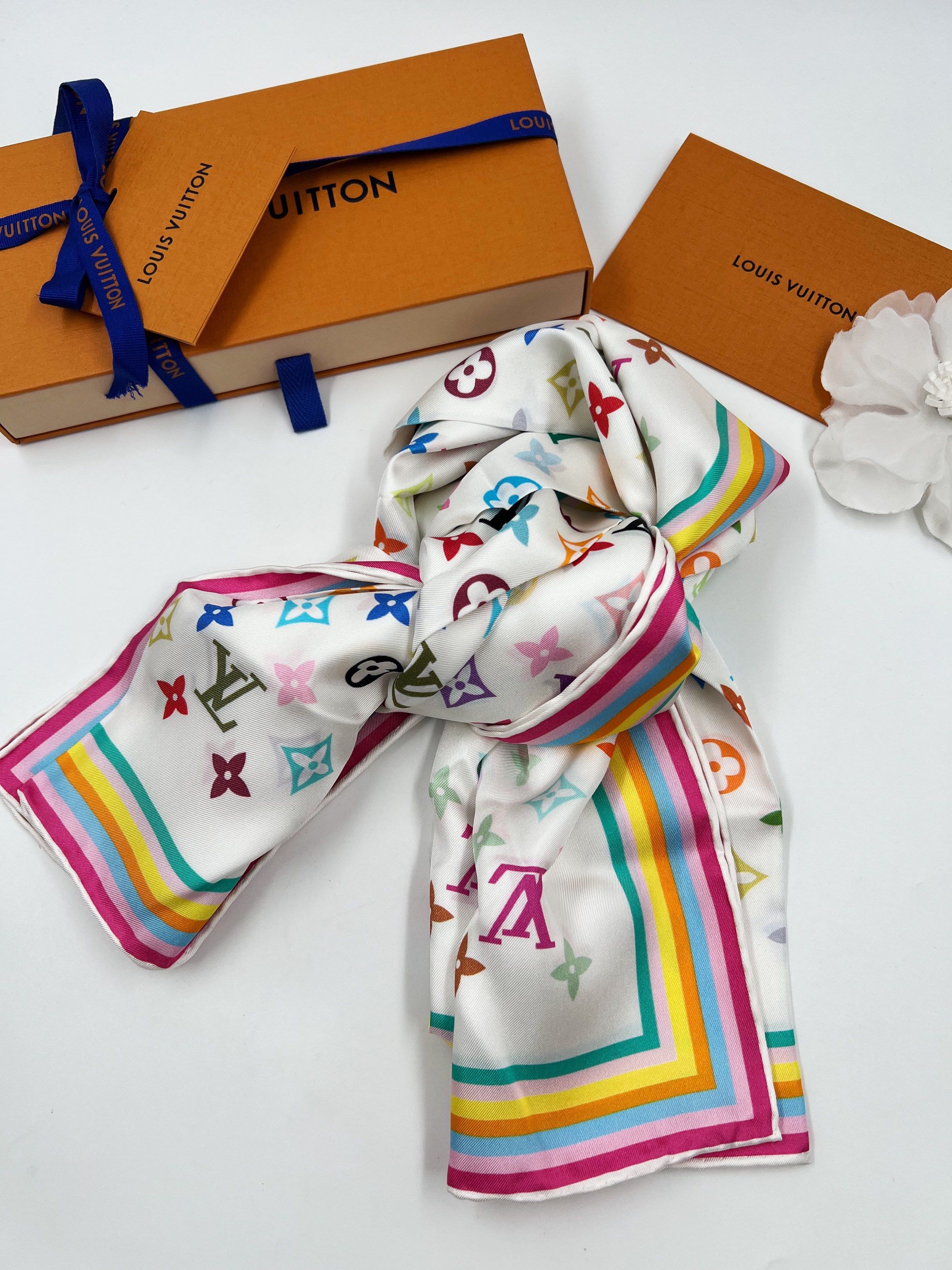 ⚜️LV x Murakami Scarf (Category: Luxury Accessories) located in Makati City. Submitted by 90sangel (Listing ID 1417457620, Image 1). Description: pure silk LV x TM scarf. 🌈🌻🐝 sale, no restock! Hard to find 90cm 🫧 Printed with Murakami’s vibrant Multicolor version of the Maison’s emblematic motifs, this versatile piece can be styled in many fashionable ways: as a hair accessory, knotted at the neck, at the waist, or on the handles of a bag. •S