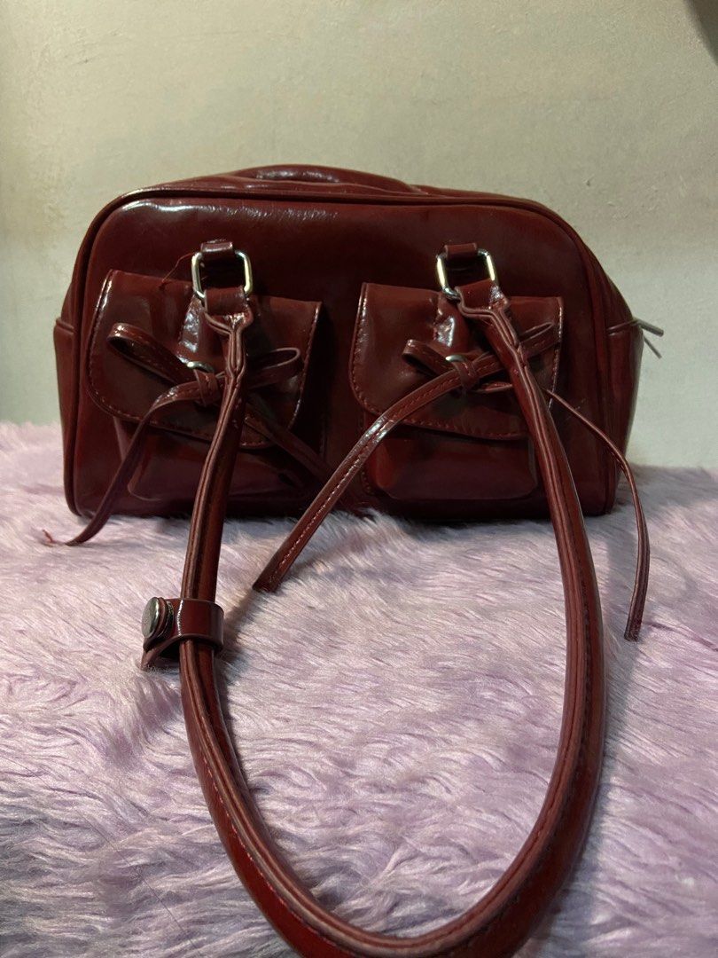 Maroon Bow Detail Handbag (Category: Luxury Bags & Wallets) located in Manila. Submitted by closet.by.ika (Listing ID 1417502916, Image 2). Description: Cherry red bag for sale!! - never been used tambak lang sa bahay 😭 - good as new 📍caloocan/malabon .