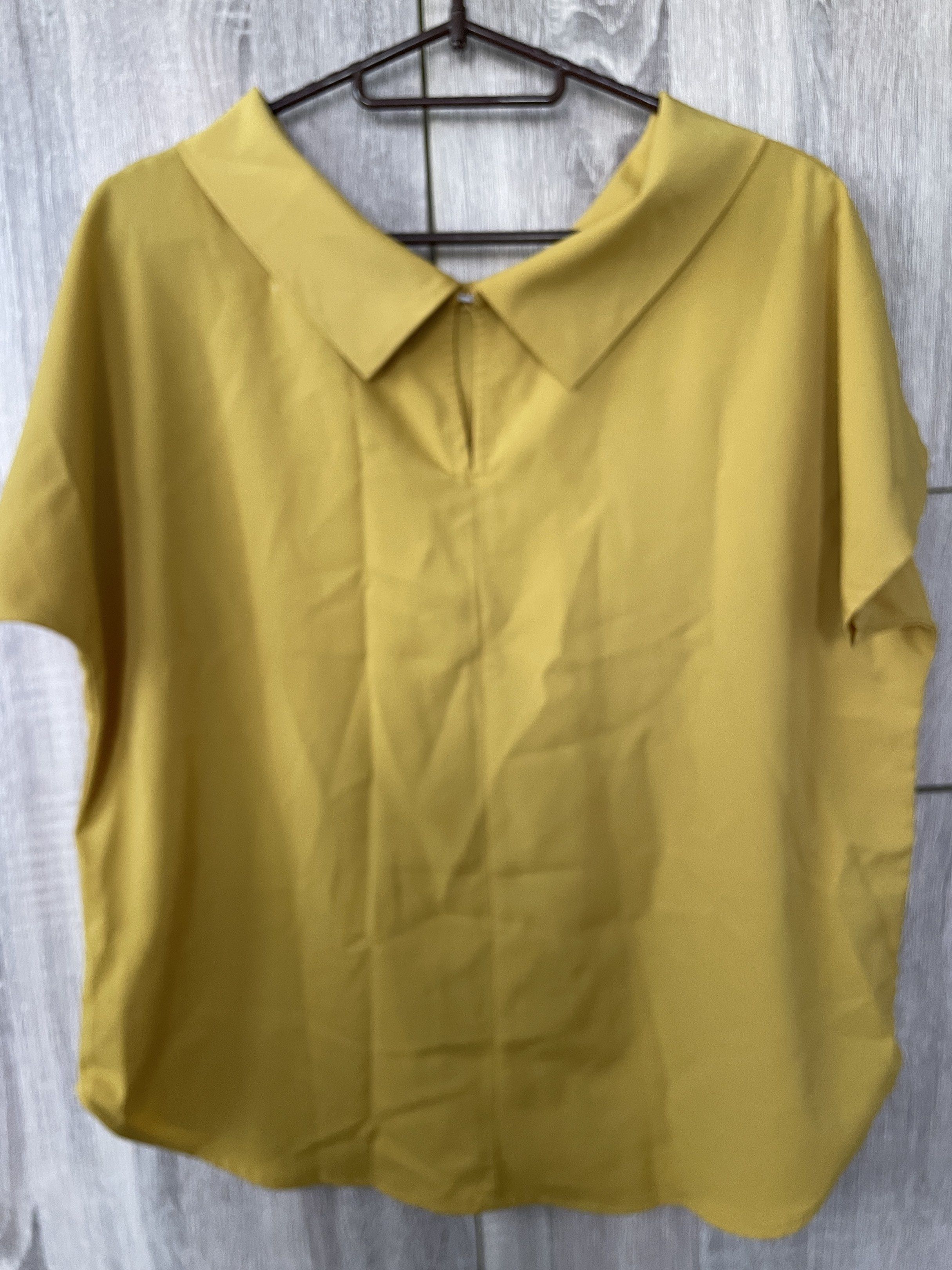 Mustard Yellow Top (Category: Blouses) located in Manila. Submitted by akingkingking (Listing ID 1417407030, Image 2). Description: - Mustard yellow top - Unique collar design - Short sleeves - Relaxed fit - buyer to shoulder shipping fee, sta mesa manila area.