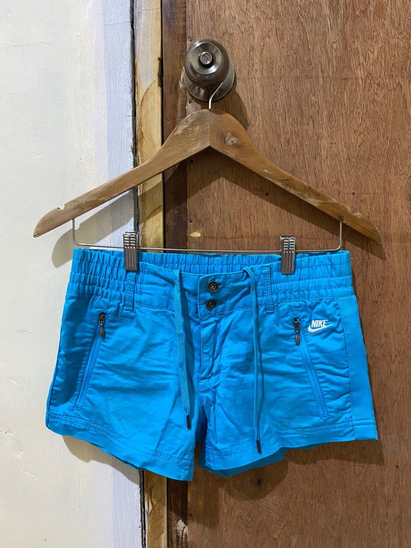 Nike Blue Shorts (Category: Shorts) located in Guimba. Submitted by xeeeyaaaah (Listing ID 1417498863, Image 1). Description: - Nike blue shorts - Drawstring waist - Two front pockets with zippers - Nike logo on front - Button closure - Comfortable fit - Perfect for casual wear or light activities -with stains.
