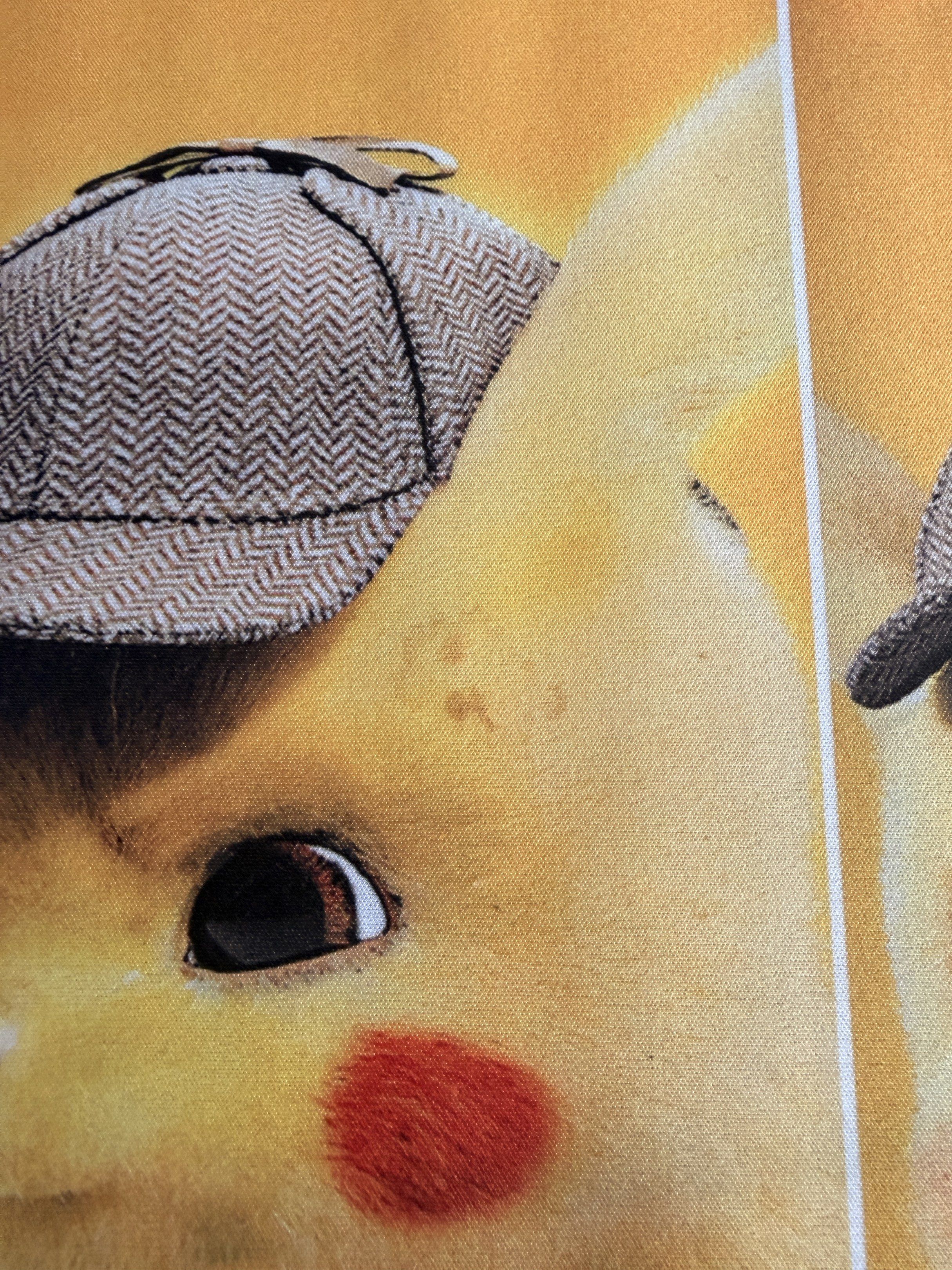 Pikachu Detective Mousepad (Category: Mouse & Mousepads) located in Manila. Submitted by ellede32655 (Listing ID 1417445569, Image 3). Description: - Pikachu Detective design - Rectangular shape - Black, textured underside - Long mousepad for mouse and keyboard - Features a repeating Pikachu image.