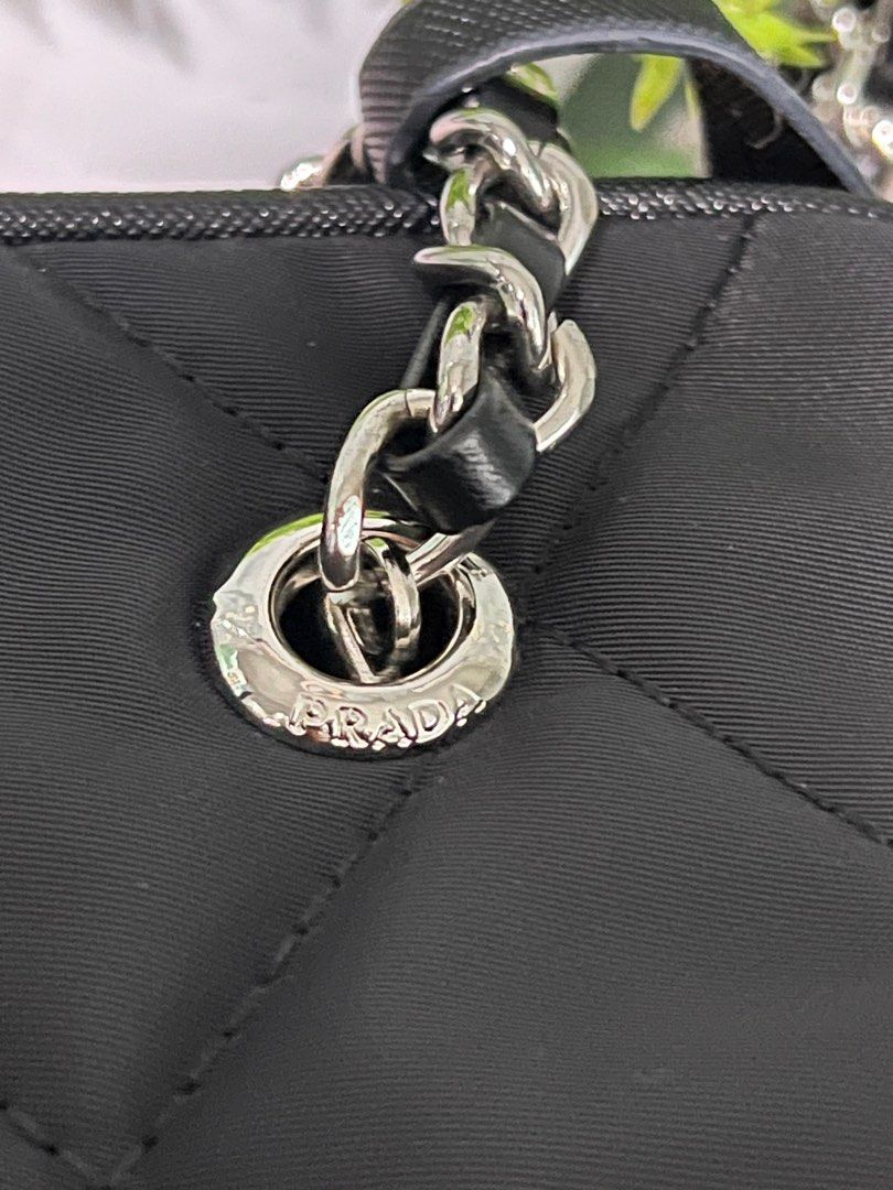 RUSH!!Prada Re-Edition 2005 Quilted Shoulder Bag (Category: Luxury Bags & Wallets) located in Quezon City. Submitted by sherashley (Listing ID 1417510489, Image 3). Description: - Prada Re-Edition 2005 shoulder bag - Color: Black - Design: Quilted - Straps: Chain and detachable long strap - Closure: Zipper - Includes: Prada tag, Made in Italy label -w/dustbag & box NOTE: bought this fr a live seller at a thrift store in Japan. The seller stated t