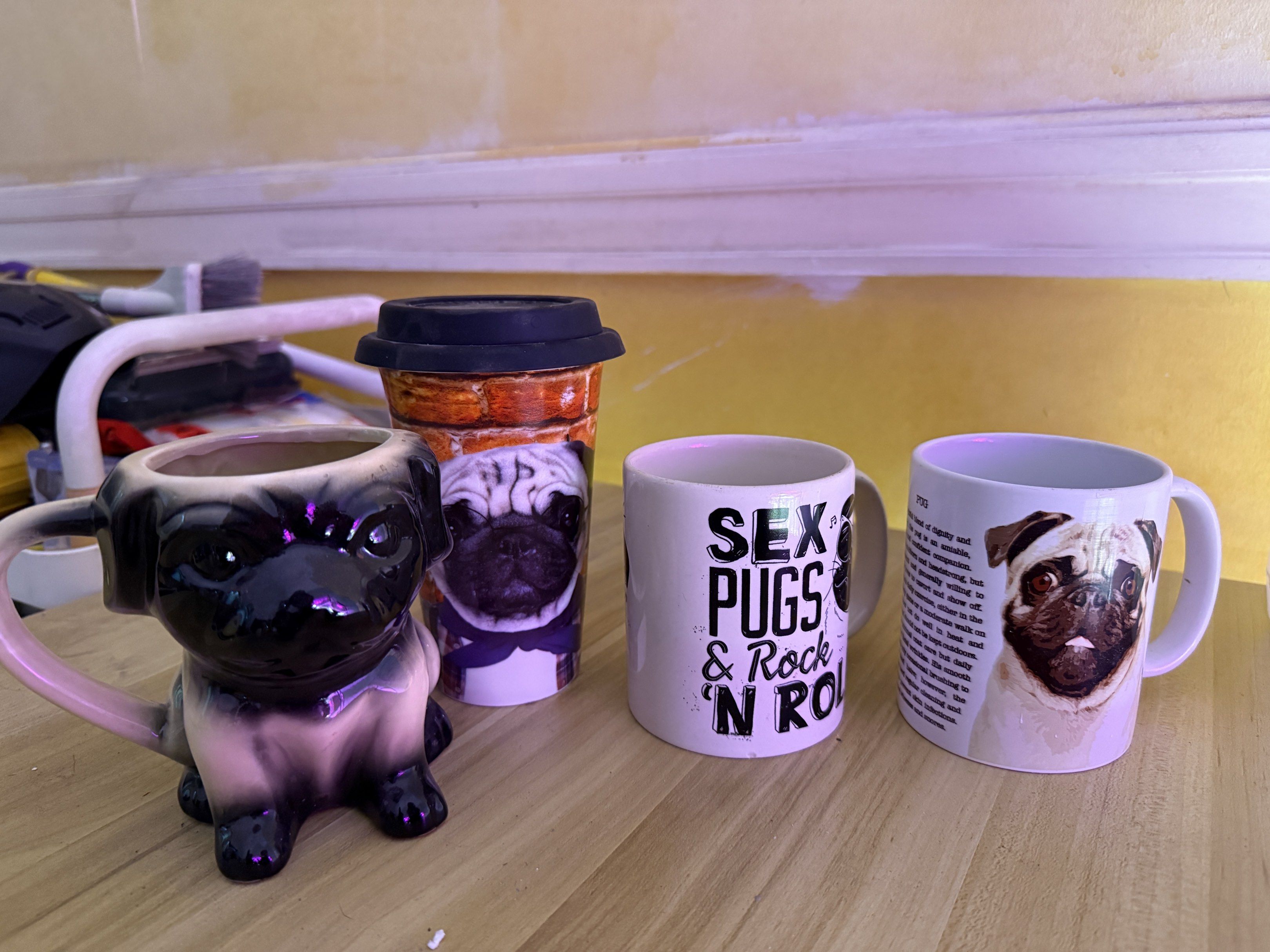 Pug Mugs Set (Category: Coffee & Tea Tableware) located in Manila. Submitted by hannaisdecluttering (Listing ID 1417519241, Image 1). Description: - Set of four pug-themed mugs. - Includes: - Ceramic pug-shaped mug - Travel mug with lid - Two standard mugs - Mugs feature: - "Sex Pugs & Rock 'N Roll" text - Pug with a description - Perfect gift for pug lovers!.