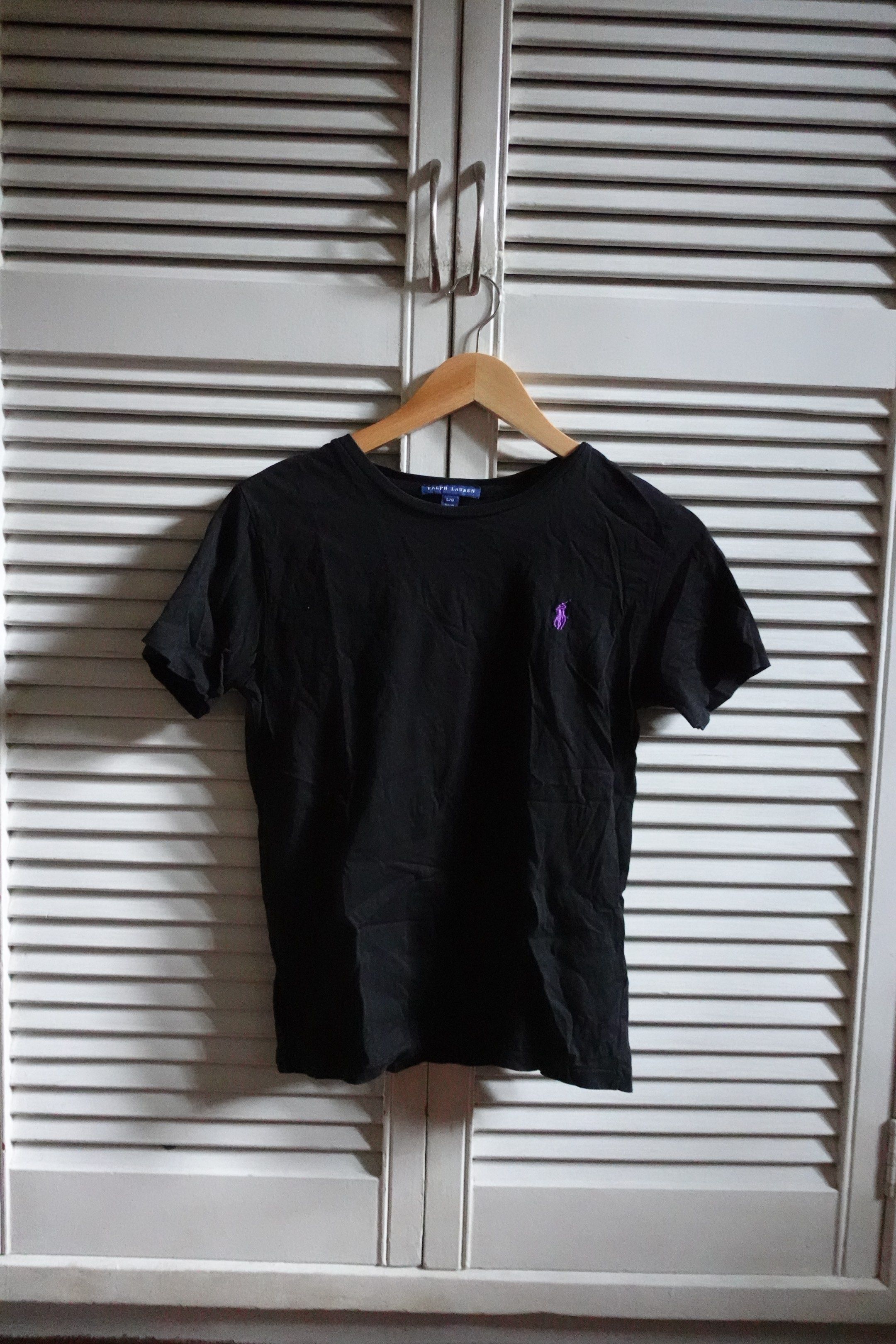 Ralph Lauren Black T-shirt (Category: Shirts) located in Marikina City. Submitted by mrgalc (Listing ID 1417549376, Image 1). Description: Ralph Lauren Black Top ✅ Authentic and original RL Size: L Condition: Well used but not abused, no stains or flaws.