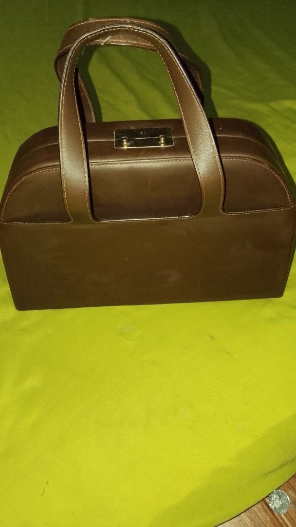 Ralph Lauren RL Collection Skipper Box Handbag (Category: Luxury Bags & Wallets) located in Cavite. Submitted by thrifteditem9_ (Listing ID 1417443090, Image 1). Description: - Brown leather handbag - Top handles - Rectangular shape - Metal clasp closure - Interior zippered pocket - Light-colored lining - Brand: Ralph Lauren (inside) - Made in Italy - Condition: very good w/minimal flaws .