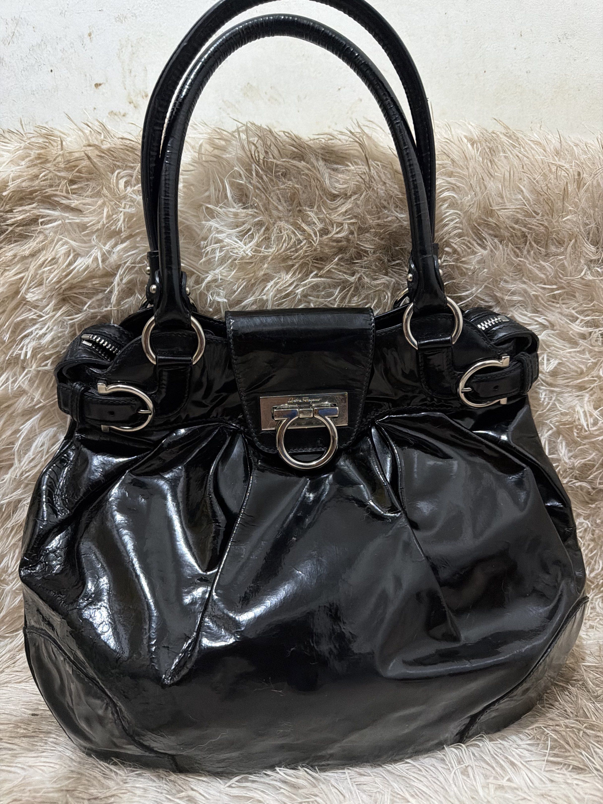 Salvatore Ferragamo Black Hobo Bag (Category: Luxury Bags & Wallets) located in Puerto Princesa. Submitted by betz0921 (Listing ID 1417563314, Image 2). Description: Very Minimal Signs of use Soft patent leather 100% Authentic Large size .