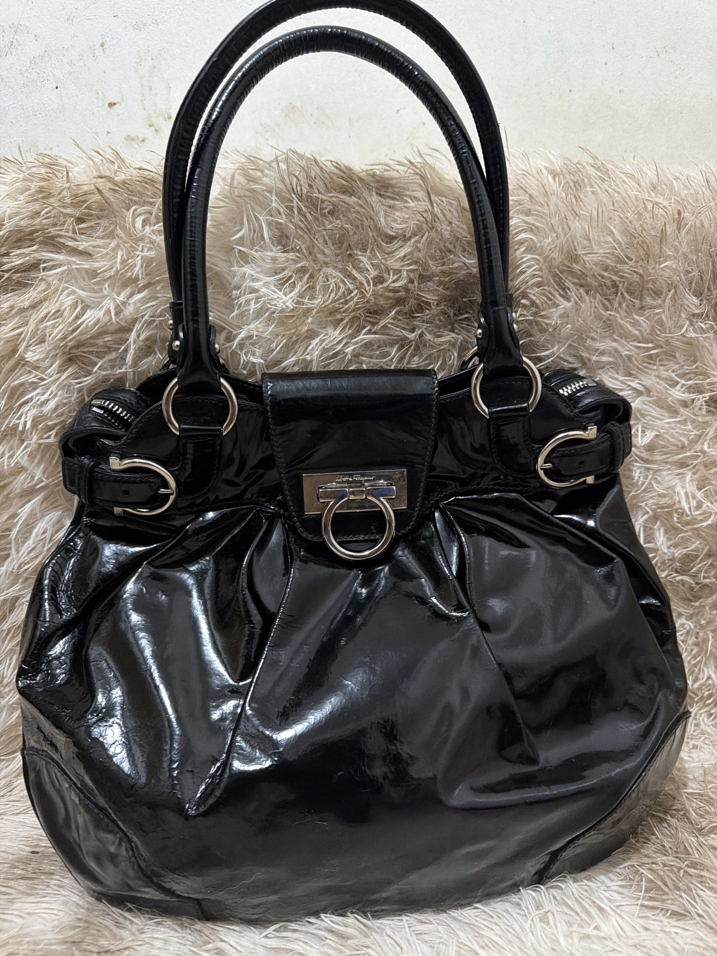 Salvatore Ferragamo Black Hobo Bag (Category: Luxury Bags & Wallets) located in Puerto Princesa. Submitted by betz0921 (Listing ID 1417563314, Image 1). Description: Very Minimal Signs of use Soft patent leather 100% Authentic Large size .