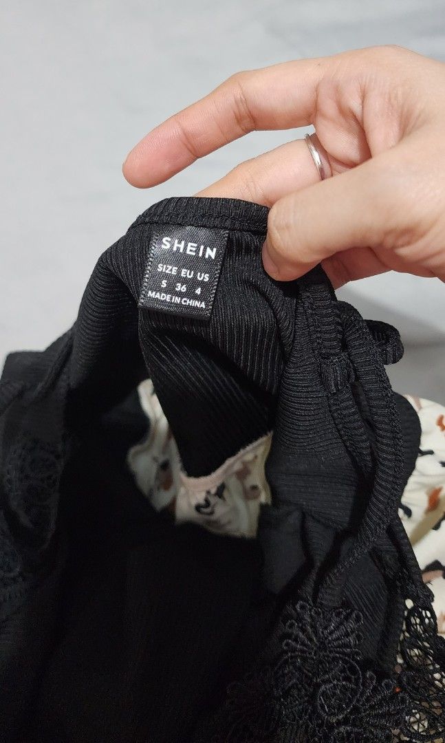 SHEIN Black and White Romper (Category: Rompers) located in Imus. Submitted by sashafame (Listing ID 1417547764, Image 2). Description: - Black top with delicate lace detailing and spaghetti straps - Eye-catching animal print bottom (white background, brown and black print) - Size: EU US 4 - Material: 95% Polyester, 5% Elastane - Ideal for casual everyday wear.