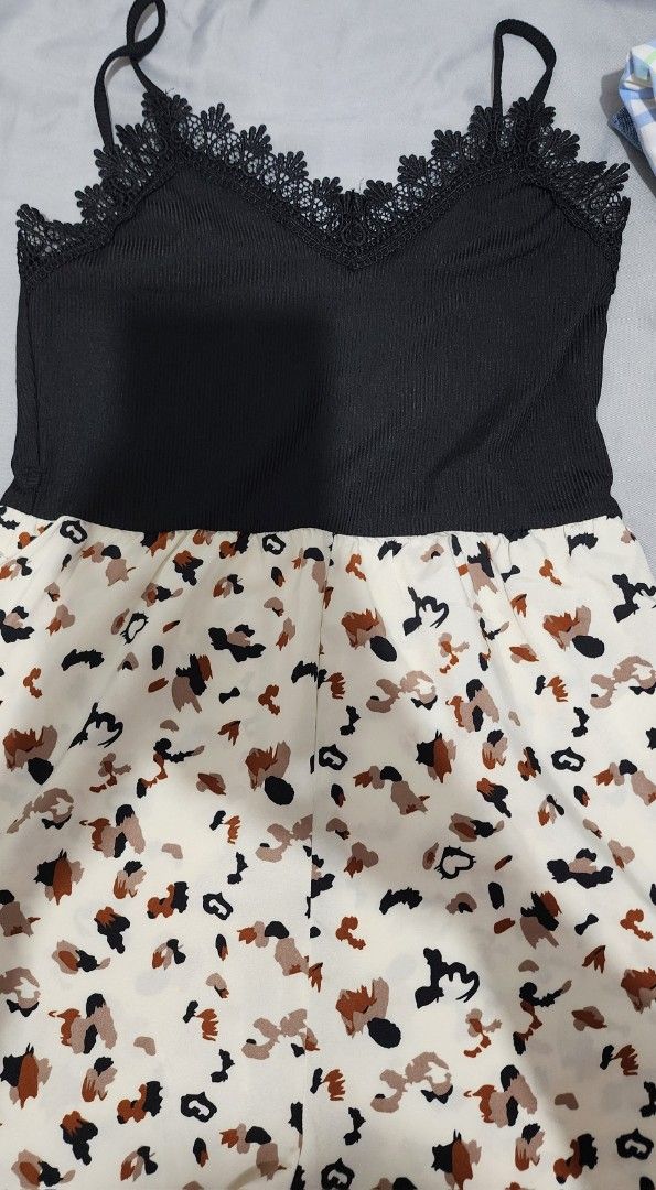 SHEIN Black and White Romper (Category: Rompers) located in Imus. Submitted by sashafame (Listing ID 1417547764, Image 3). Description: - Black top with delicate lace detailing and spaghetti straps - Eye-catching animal print bottom (white background, brown and black print) - Size: EU US 4 - Material: 95% Polyester, 5% Elastane - Ideal for casual everyday wear.