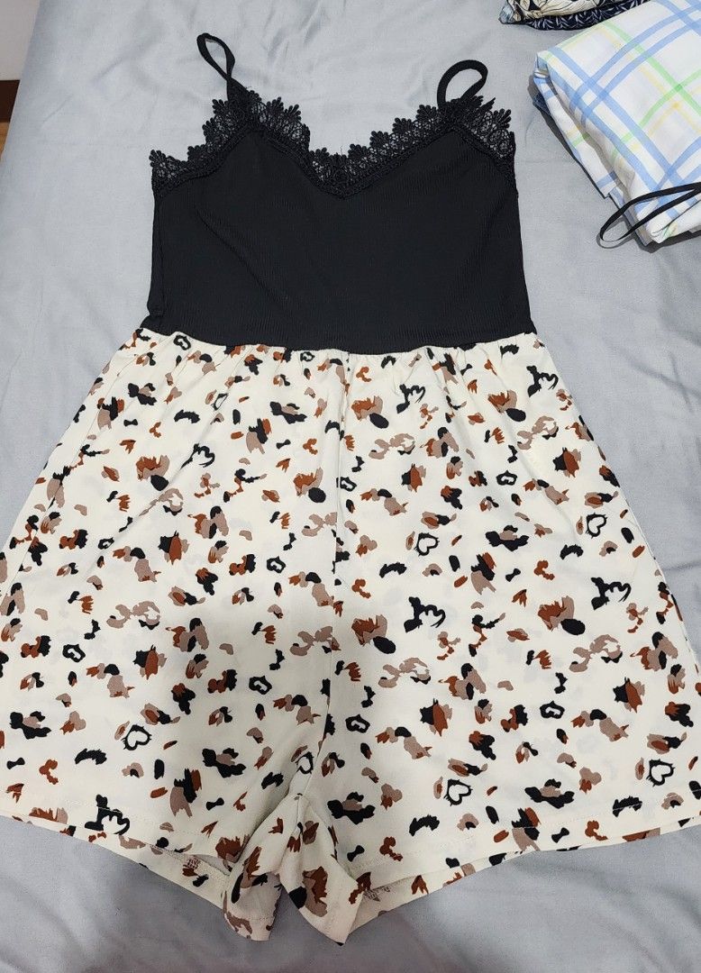 SHEIN Black and White Romper (Category: Rompers) located in Imus. Submitted by sashafame (Listing ID 1417547764, Image 1). Description: - Black top with delicate lace detailing and spaghetti straps - Eye-catching animal print bottom (white background, brown and black print) - Size: EU US 4 - Material: 95% Polyester, 5% Elastane - Ideal for casual everyday wear.