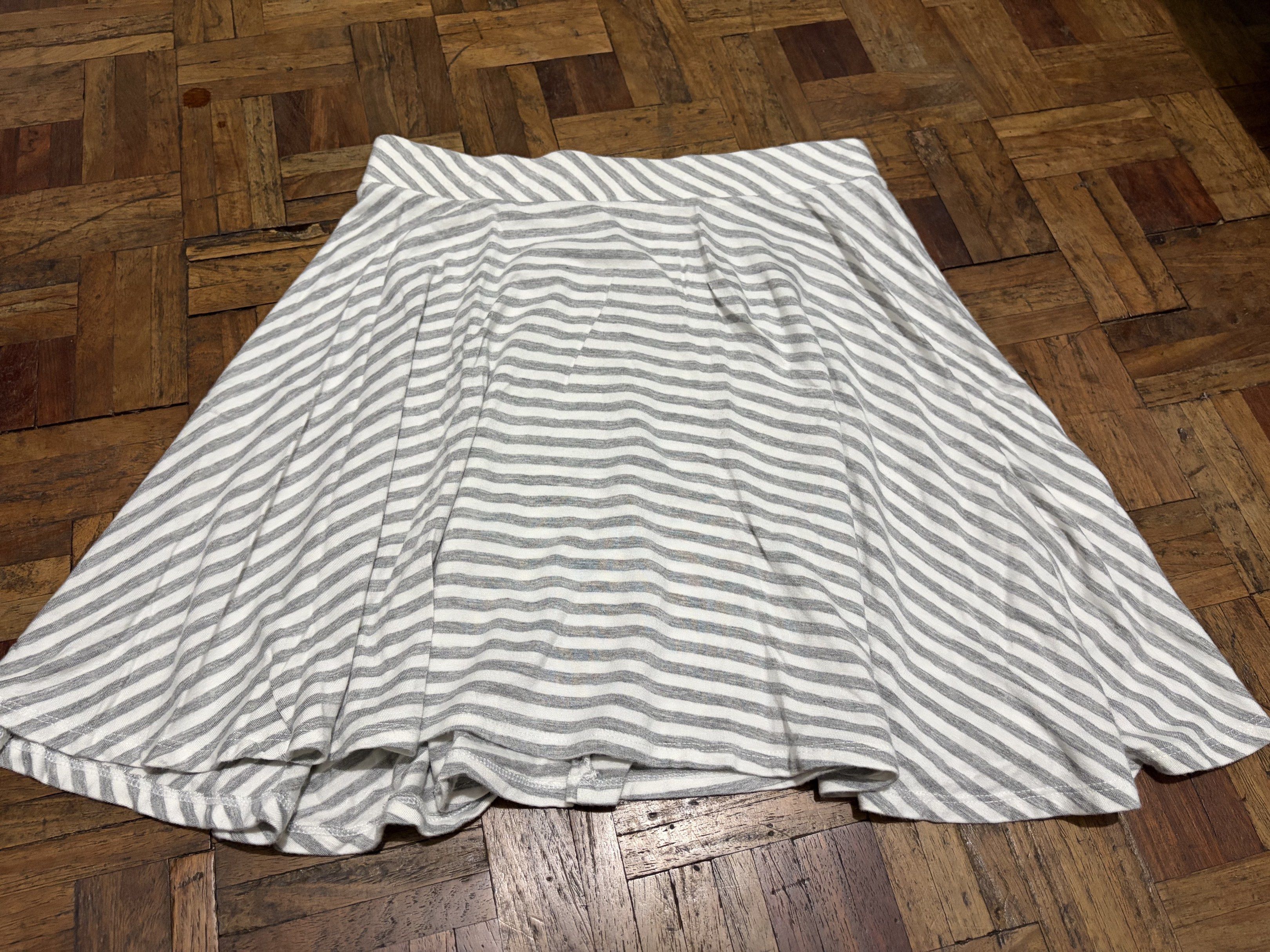 striped skirt (Category: Skirts) located in Las Pinas. Submitted by nylth (Listing ID 1417549572, Image 1). Description: - Striped Skater Skirt - Size: M - Condition: Used, worn a few times - Design: Classic striped pattern.