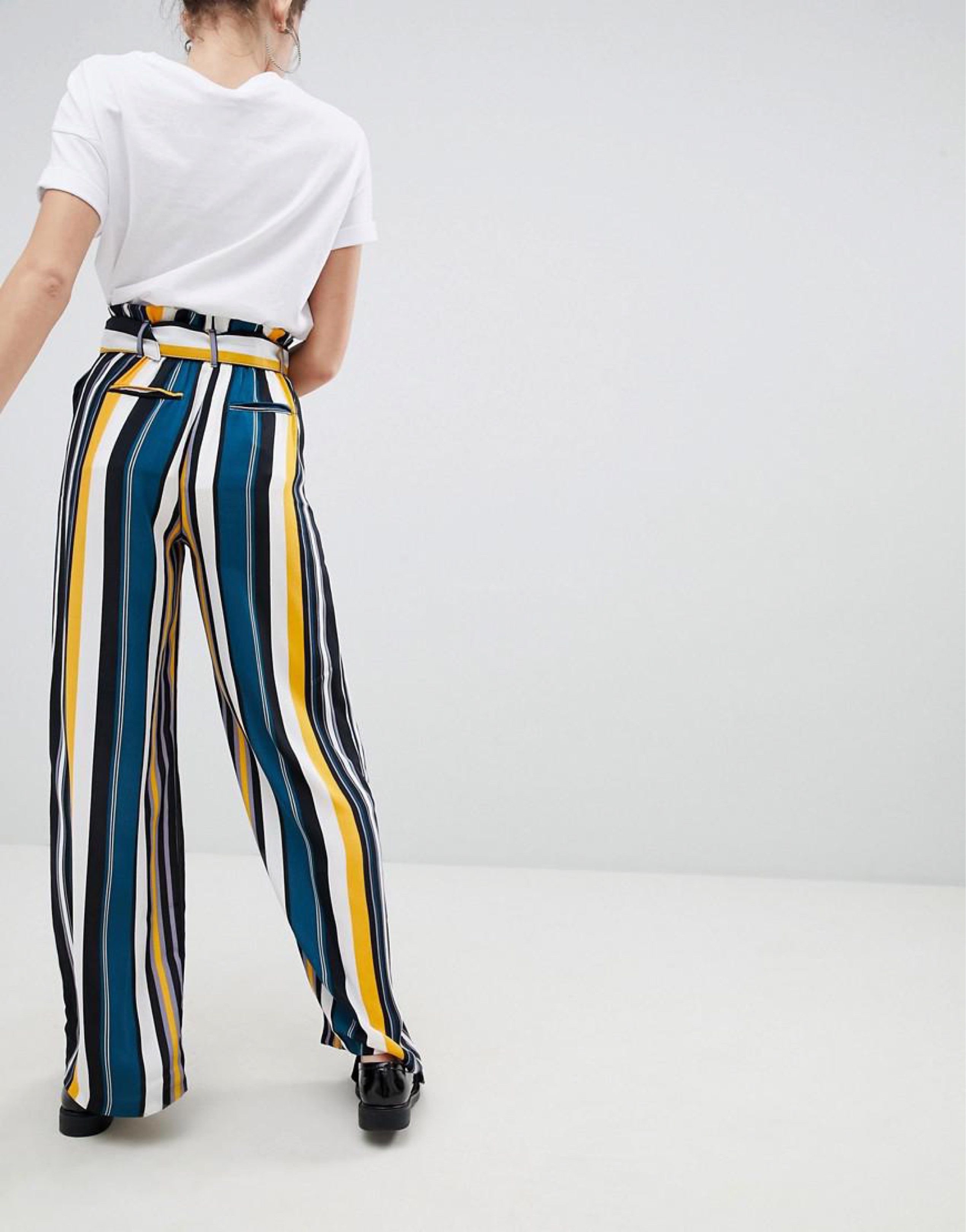 Striped Wide Leg Pants with Belt (Category: Other Bottoms) located in Makati City. Submitted by secondavenue_ (Listing ID 1417411308, Image 2). Description: - Wide-leg pants - Striped pattern: yellow, black, white, teal - High-waisted - Includes matching belt with circular buckle - Perfect for a chic and comfortable look - US Size 2.