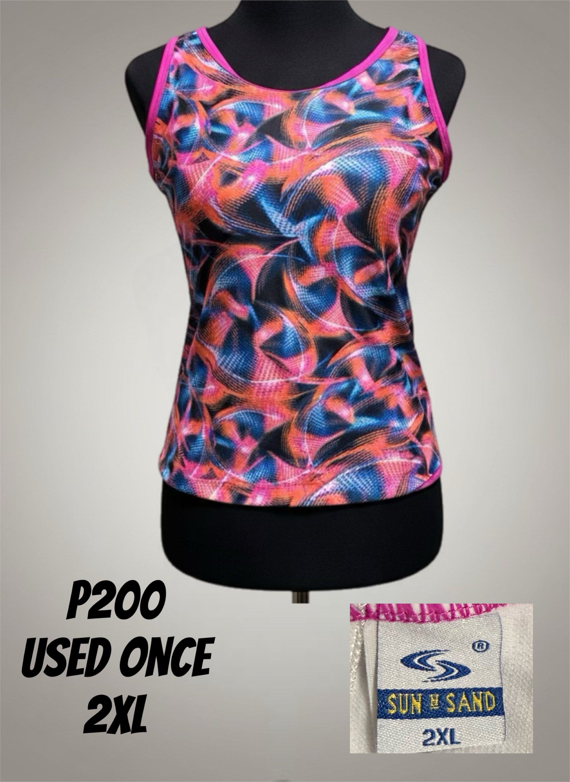 Sun N Sand Tank Top 2XL (Category: Sleeveless) located in Santo Tomas. Submitted by moanafayzee (Listing ID 1417583219, Image 1). Description: - Sun N Sand tank top - Size: 2XL - Design: Colorful abstract with pink trim - Condition: Gently used (worn once) - Price: P200.