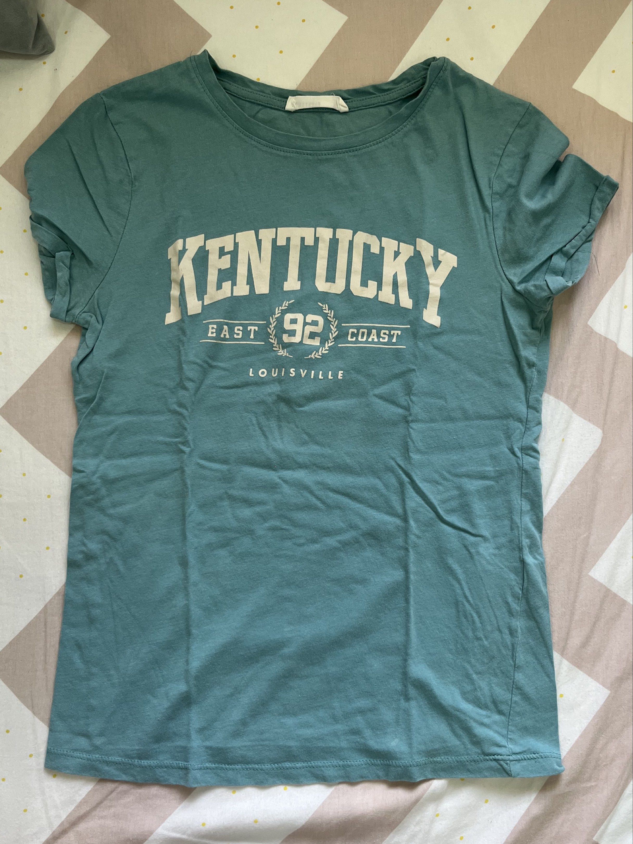 Terranova Kentucky Graphic Tee - Size S (Category: Shirts) located in Quezon City. Submitted by goatedls (Listing ID 1417428172, Image 1). Description: Good condition - Size: Small - Color: Teal.