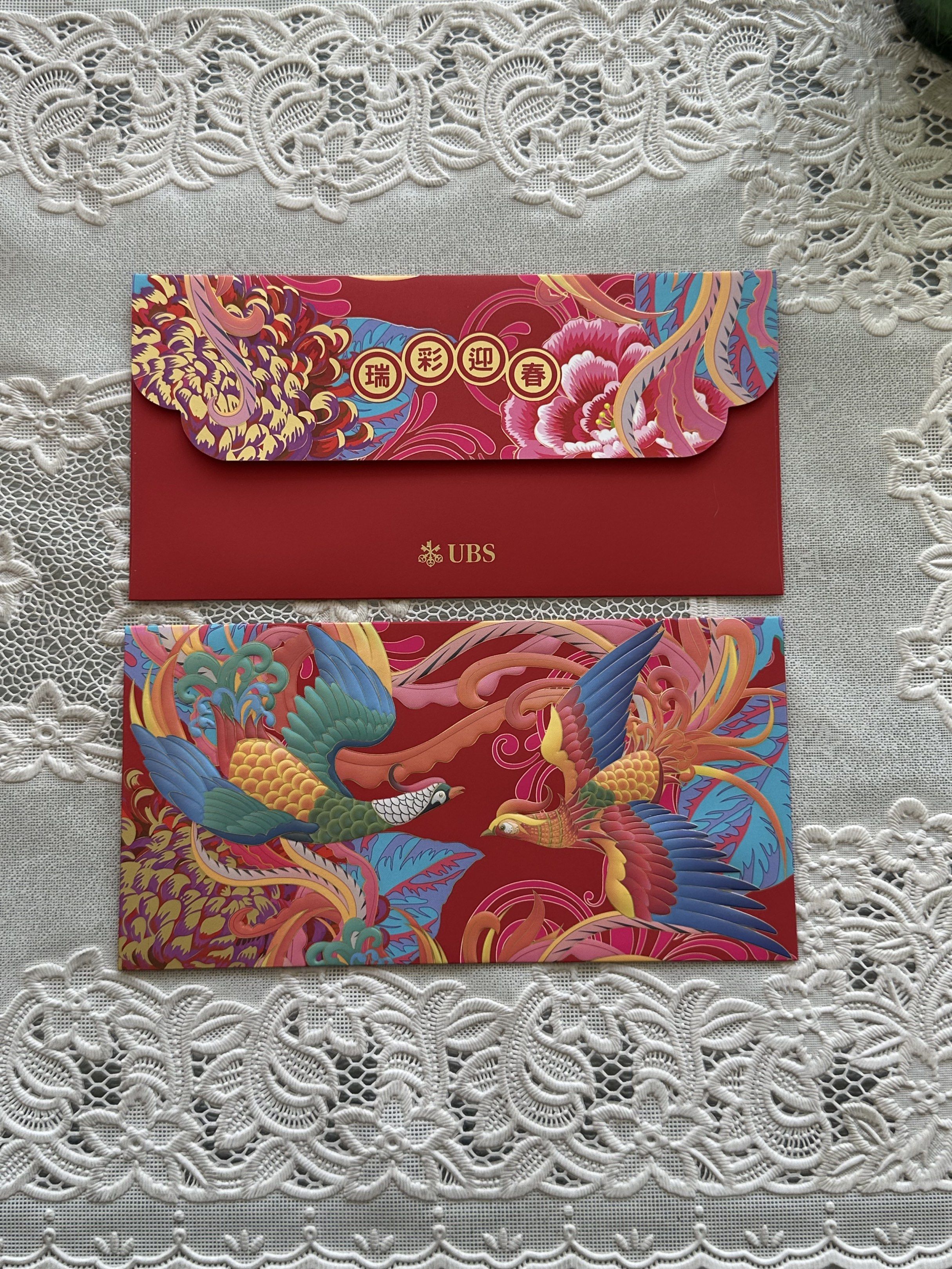 UBS Red Packets (Category: Other Stationery & Craft) located in Singapore. Submitted by chloemee (Listing ID 1417543808, Image 3). Description: Very pretty UBS phoenix red packets. 1 set available 8 pieces in a set (4 red 4 gold) $6 Inclusive of normal mail Ang pao/ang bao/red packets 🍊🧧 Red packet for Chinese New Year 2026.