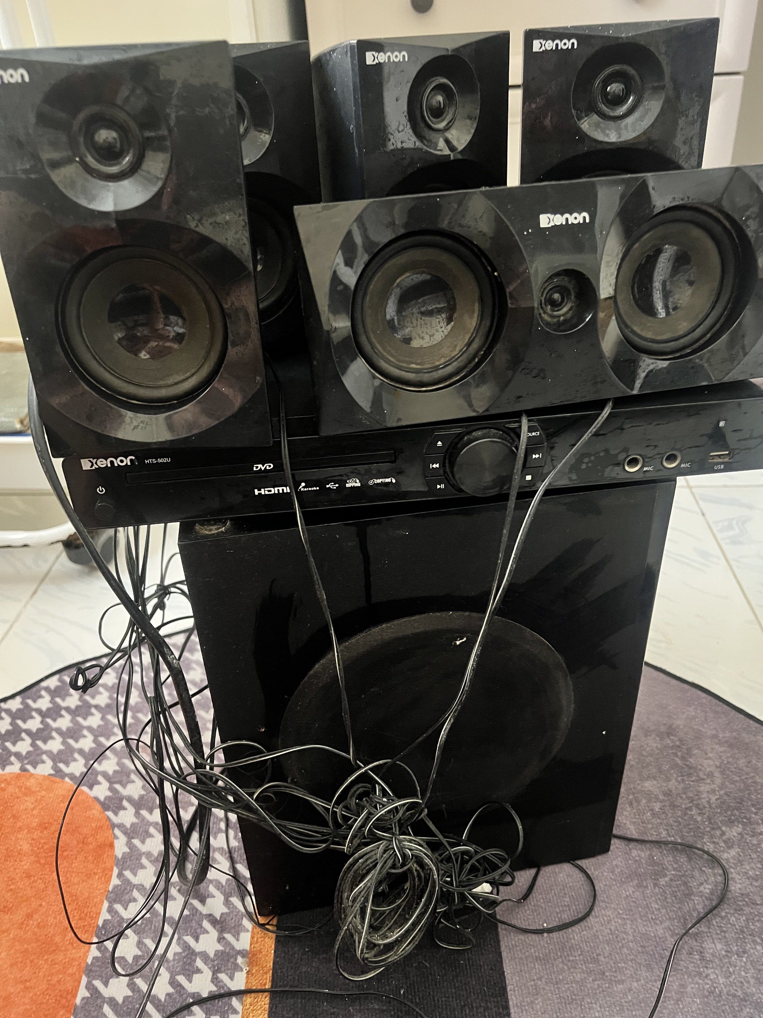 Xenon Home Theater System (Category: Soundbars, Speakers & Amplifiers) located in Caloocan City. Submitted by kcconstntino (Listing ID 1417516577, Image 2). Description: - Xenon home theater system - Includes DVD player, subwoofer, and speakers - HDMI connectivity - All components are black - Includes all necessary wires - Ready for home entertainment.