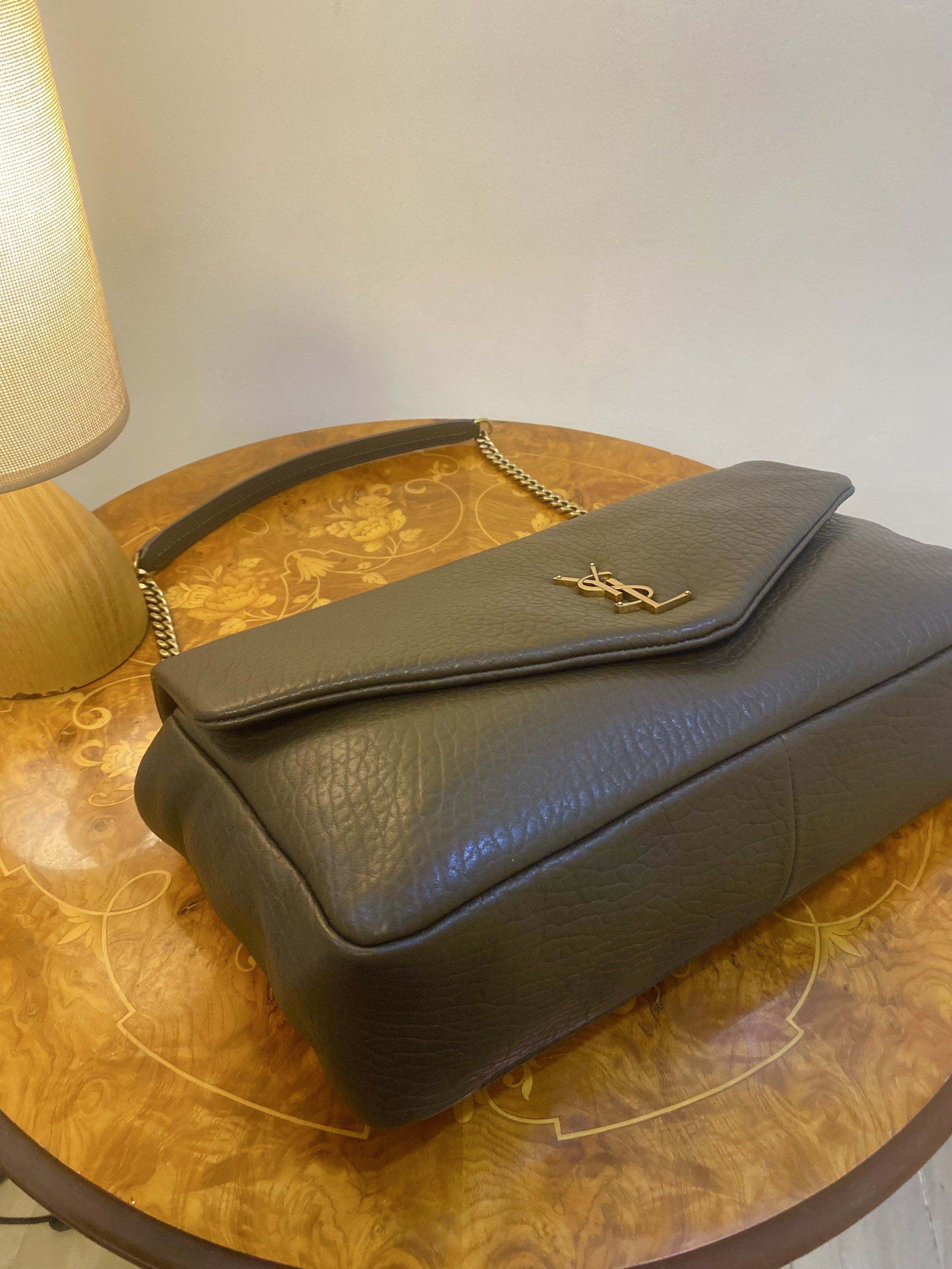 YSL Sling bag crossbody bag (Category: Luxury Bags & Wallets) located in Silang. Submitted by girlyouneedthis (Listing ID 1417461750, Image 3). Description: YSL Calypso large in this beautiful textured green genuine leather. Very spacious, can be sling bag and a crossbody bag. Coded, Comes with dustbag only. Size Height 23 CM Width 35 CM.